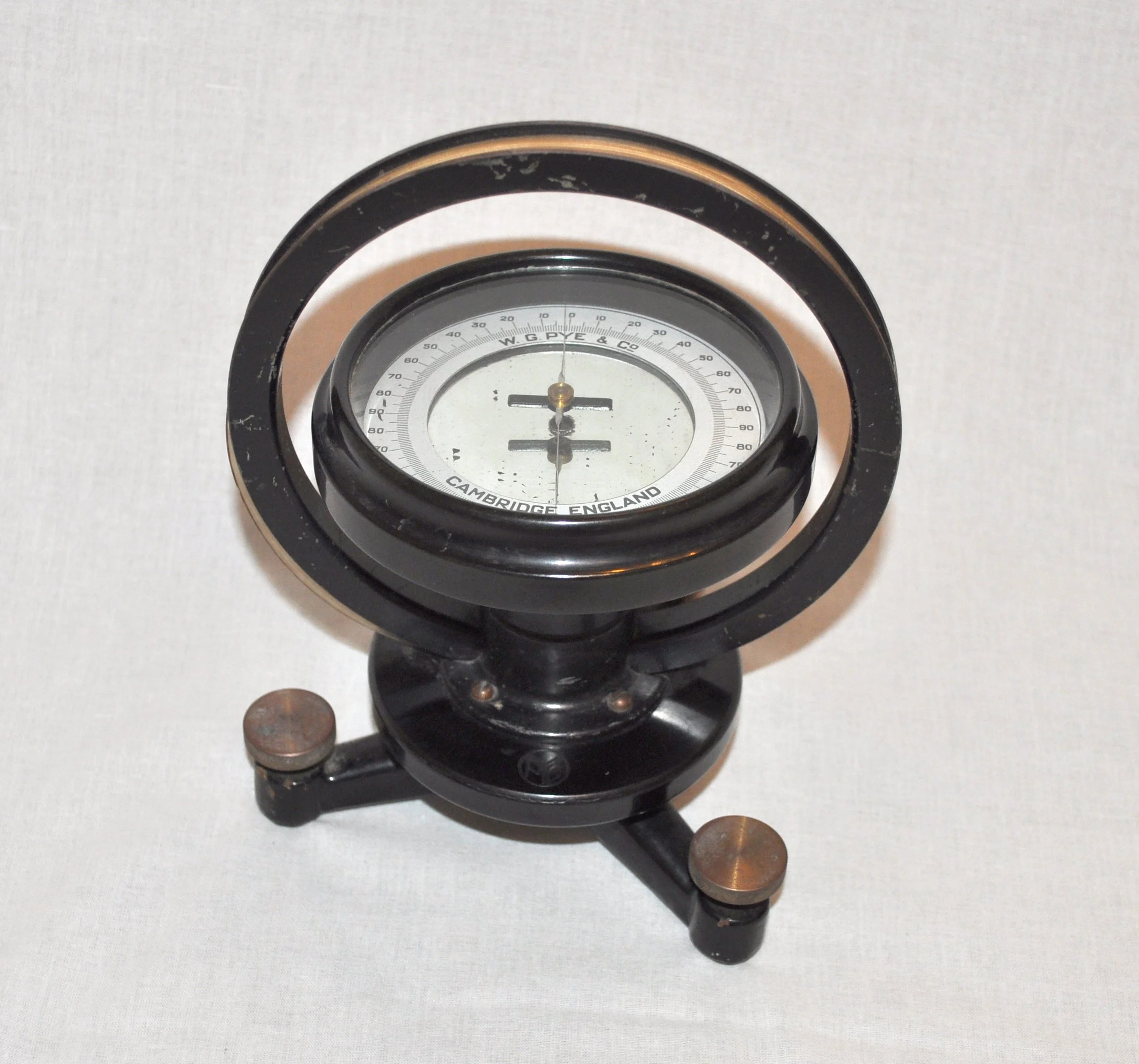  One of the earliest examples of a Pye instrument, this tangent galvanometer was listed in the 1906 catalogue. Essentially, a magnetic compass within a coil of wire, the device indicated the strength of current in the coil 