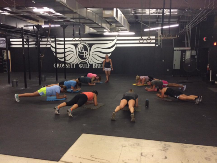 Coach Candace observing planks during a CFGB Bootcamp class
