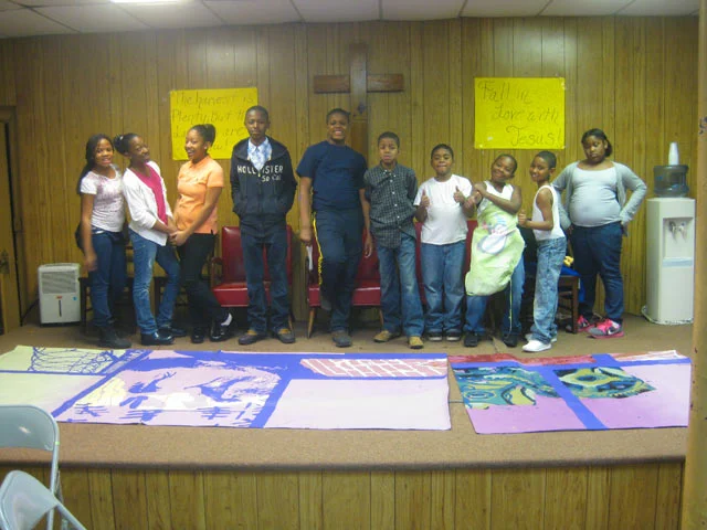  King Solomon Baptist Church, is the building adjacent to the mural. The mural's stained glass windows reflect those of the church, as a way to incorporate the mural's surroundings. Paint days were held in its basement.&nbsp; 