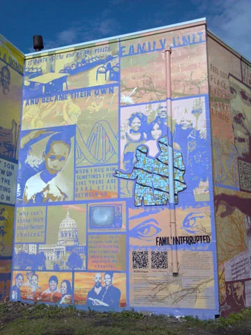  The “w” shaped wall lends itself to the narrative. The “incarcerated” right side of the wall is tucked away from view at first glance. It contains the faces and stories of ex-offenders and those still behind bars. Its about how their incarceration a