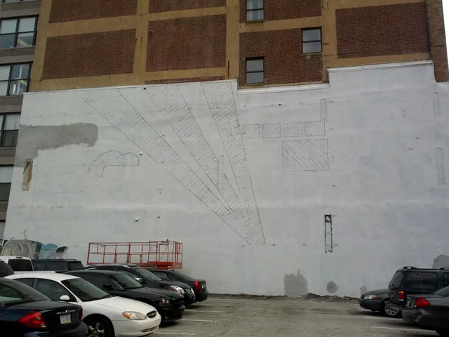 Since we were covering an older mural, I had to spend my first week plotting the placement of the mosaic, and then grinding away the paint from the wall to lay our glass on fresh stucco. 