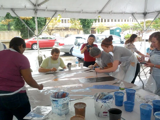 On that rainy day, volunteers painted a record 12 5'x5' panels. The most for the project during one event, and the most I had ever seen at any of my paint days. 
