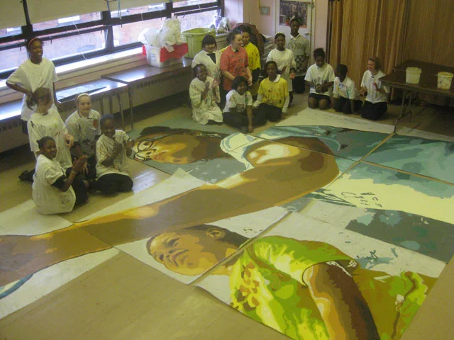 Sr. Deborah's art class poses next to all their hard work. 