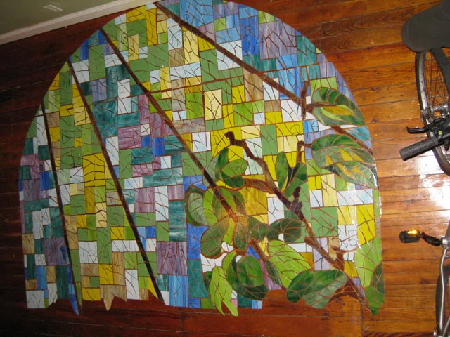  The tiny squares within the rays had to be divided into smaller segments to ensure that most of the glass would be in contact with the thinset. The larger the shape the less likely is was to fully rest on the imperfect wall.&nbsp; 