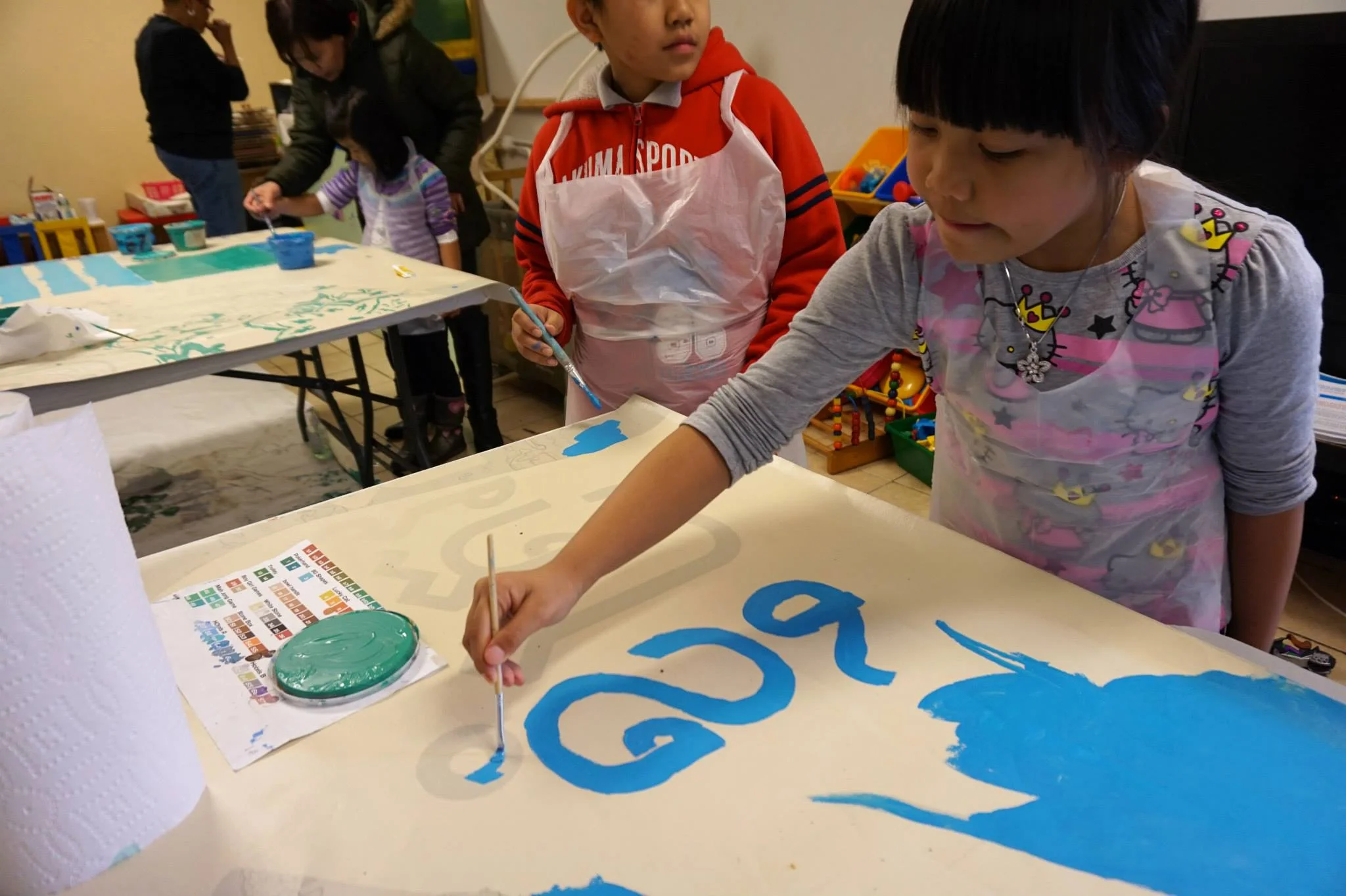 Paint day in the local day care where the mural appears. 
