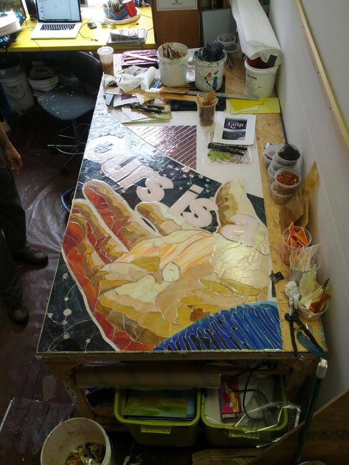Beginning work on the last glass panel. 