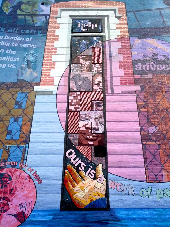 The mural features prominent portraits of many celebrated social workers and the families they serve. Many portraits were painstakingly fabricated in stained glass and colored mirror. 