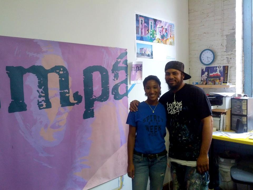Olivia Nutter, the Mayor's daughter, kicked off the painting in the studio by blocking in the very first panel of the mural. She is standing next to Salaam, my assistant. 
