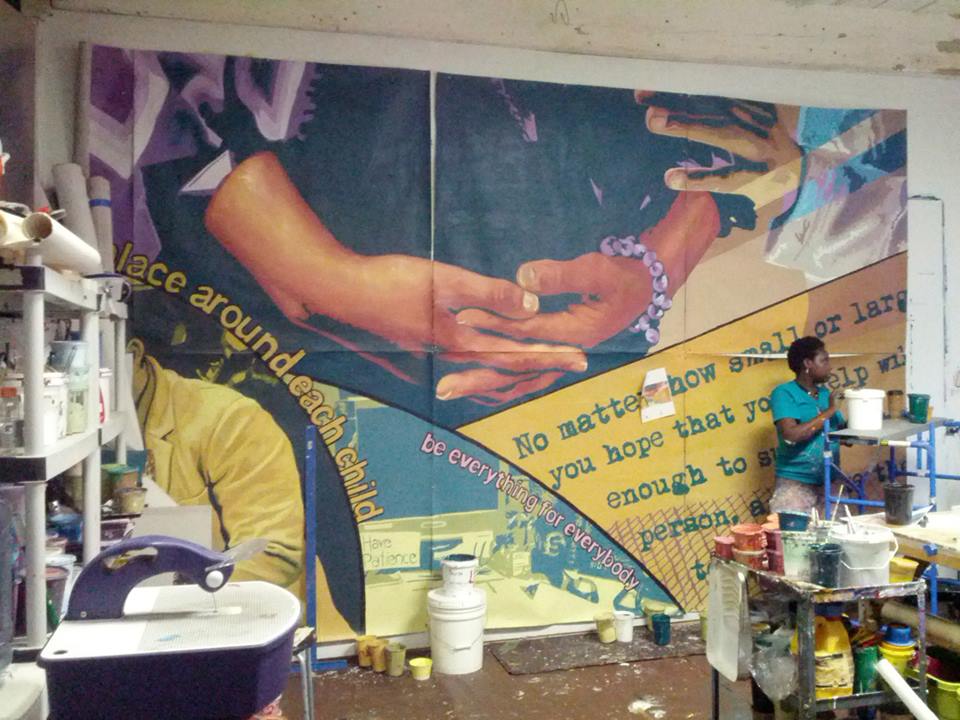 The left side of the project was painted by my mural class in Graterford Prison. 