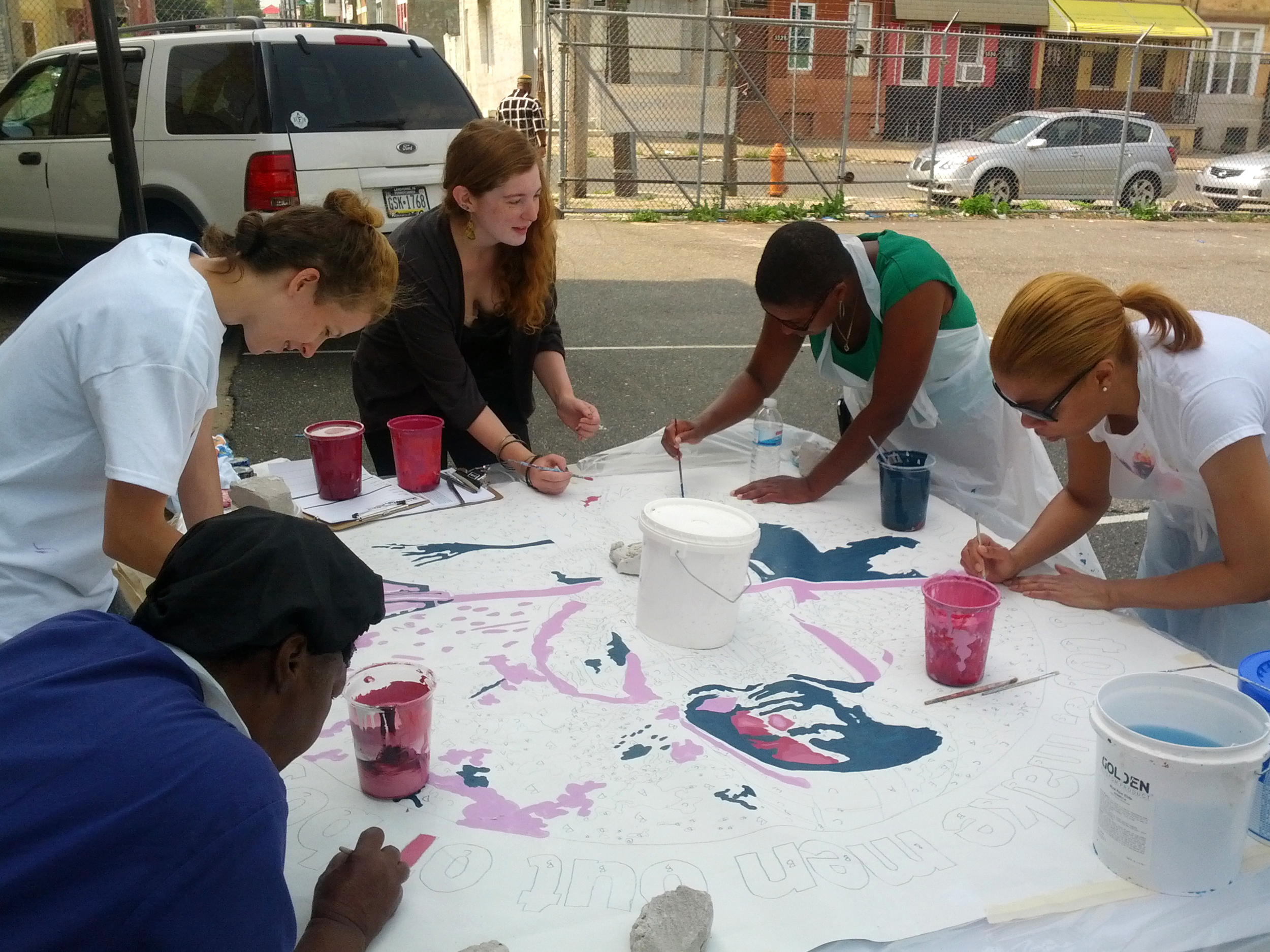We held one final community paint day in late July. This was to create some additional imagery that was specifically meaningful to the community surrounding the mural. Its a challenging task to develop a mural's concept and design with certain stake