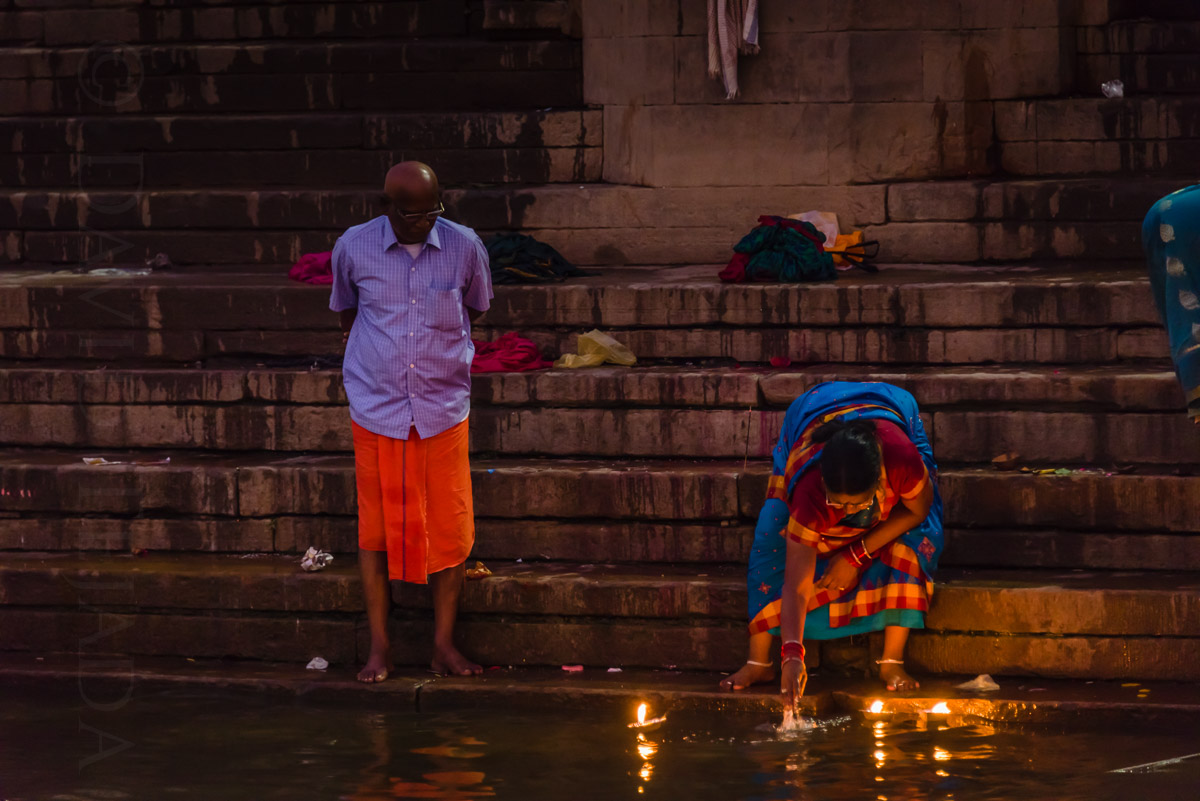 Offering prayers and floating tiny candles on the river