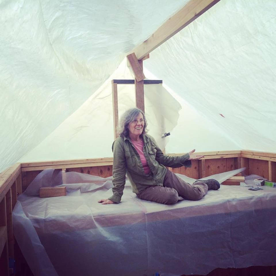 Lisa in her storage loft before we put the roof on.