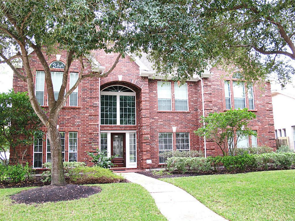 The house I've lived in the longest—in Houston, space is cheap. My room was the top right trio of windows.