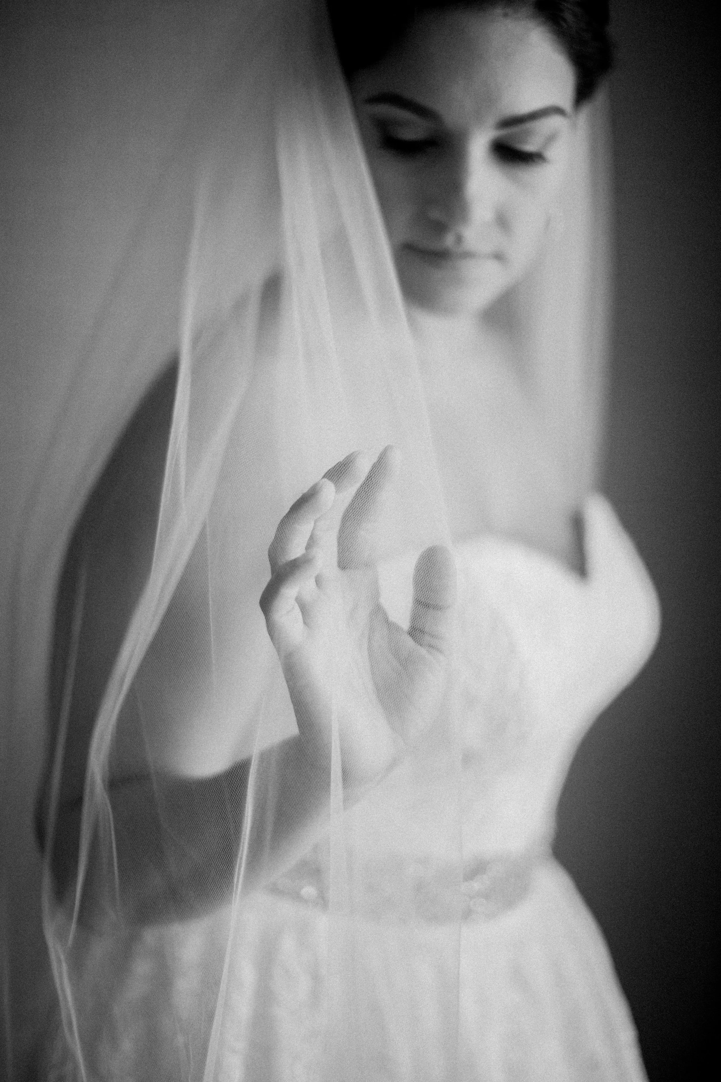 I love this image of Liz getting ready, as she slowly runs her fingers through the fabric of her veil on her wedding day.
