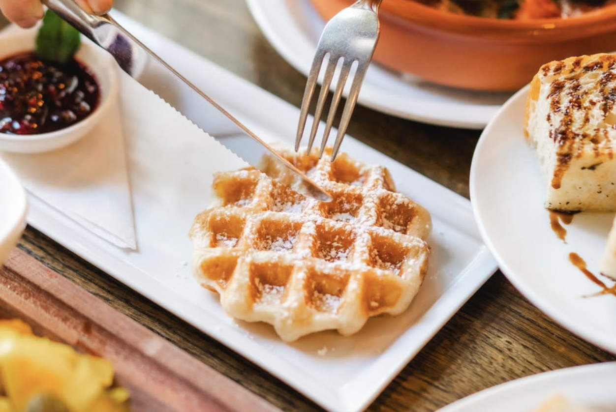 Signature Belgian waffles served at a lively café