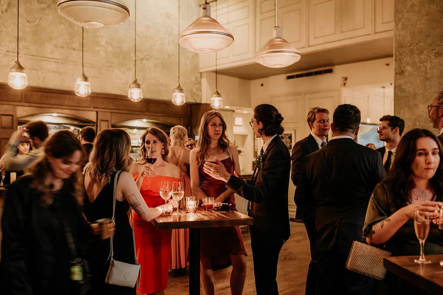 Corporate party and private dining celebration with guests gathered around a table