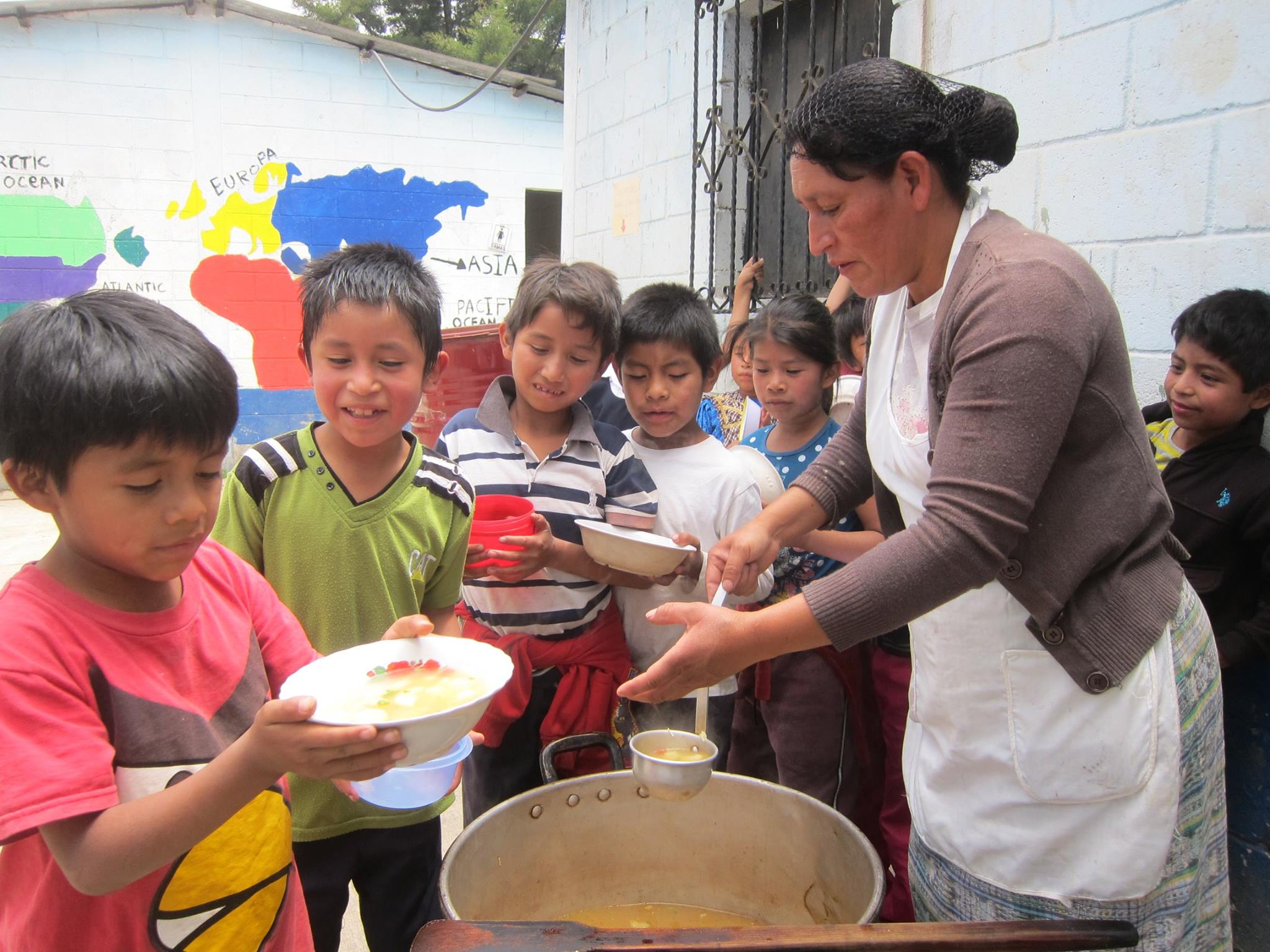  Children receive their daily snack, to which our Health and Nutrition Program contributes. 