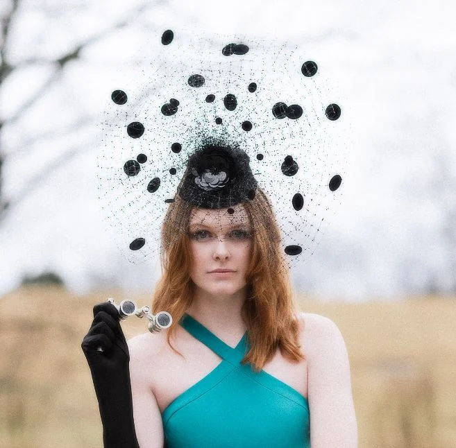 Photo by Adrian Morales featuring a fascinator by Los Angeles milliner, Arturo Rios , and dress from Stacey Rhodes Boutique with model Emily Grace King .