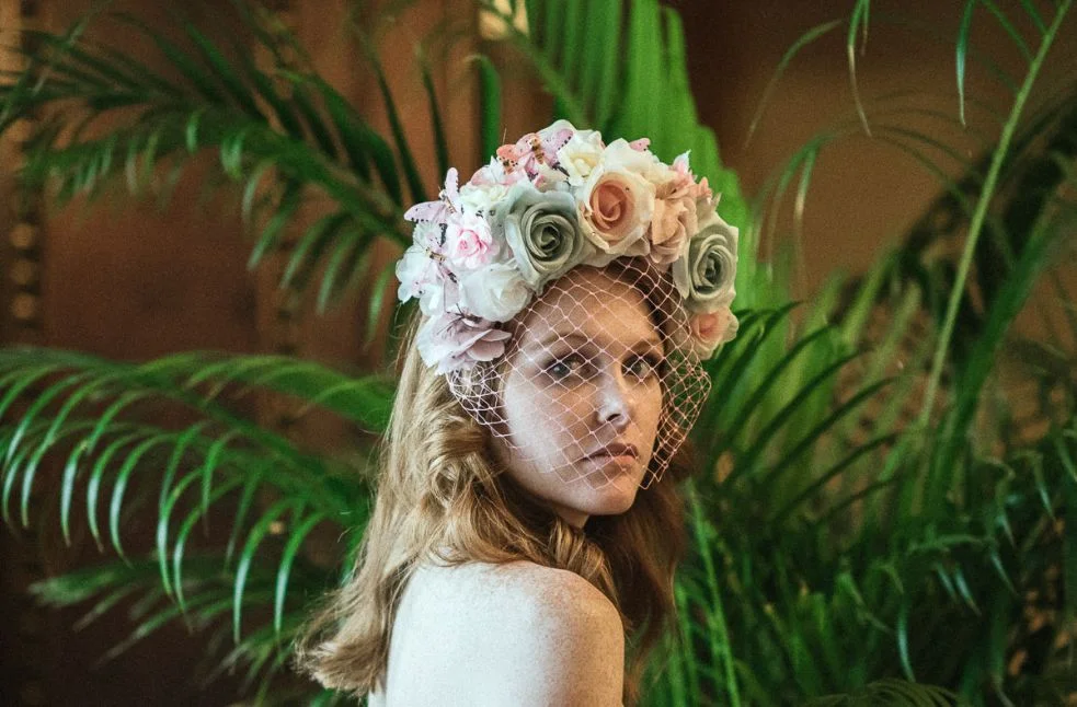 Model, Emily Grace King , wearing a beautiful floral and butterfly headband by Los Angeles milliner, Arturo Rios . Photo by Adrian Morales in The Hermitage Hotel Ballroom.