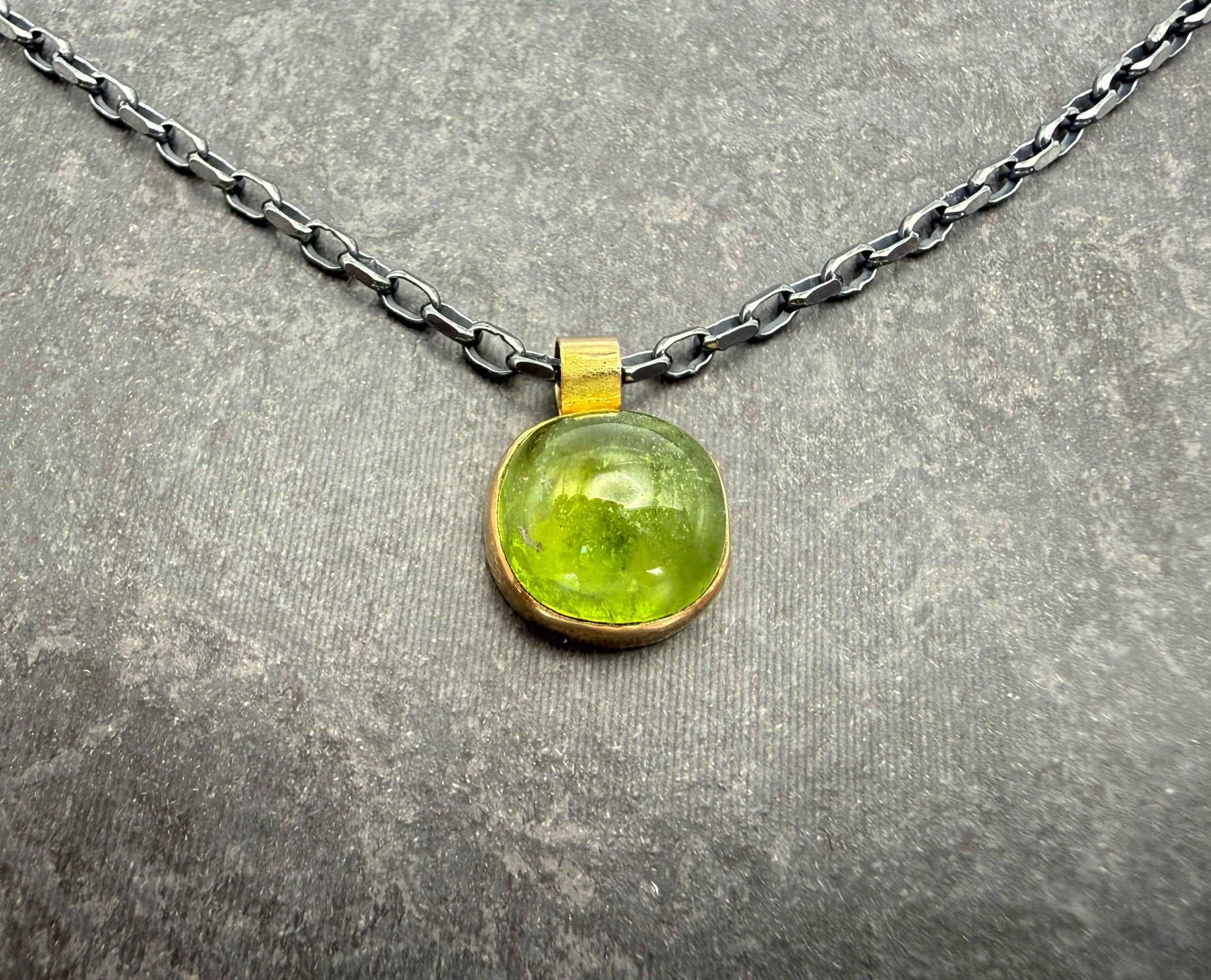 gold peridot pendant with oxidized silver chain