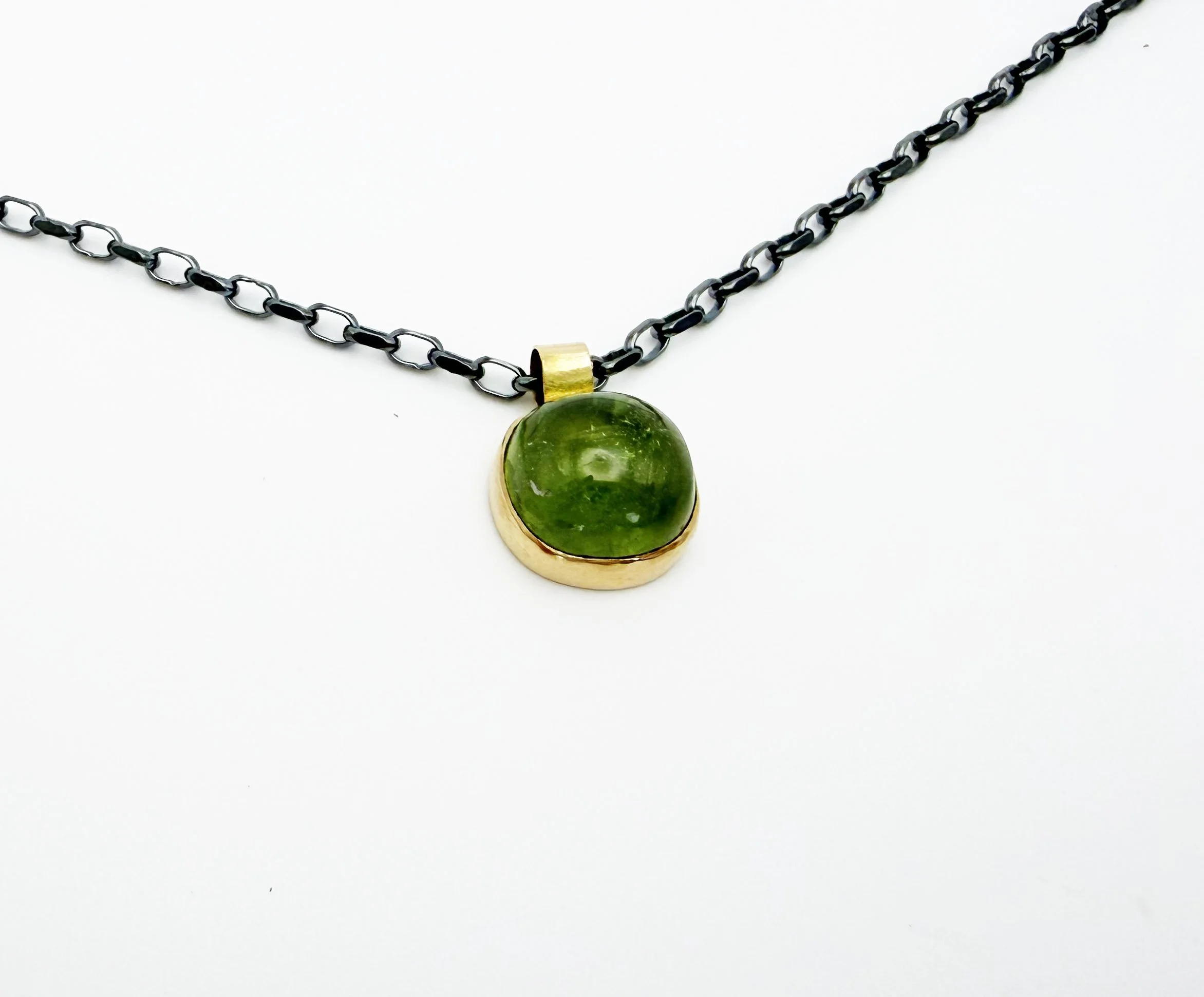 bezel set peridot pendant necklace with silver chain