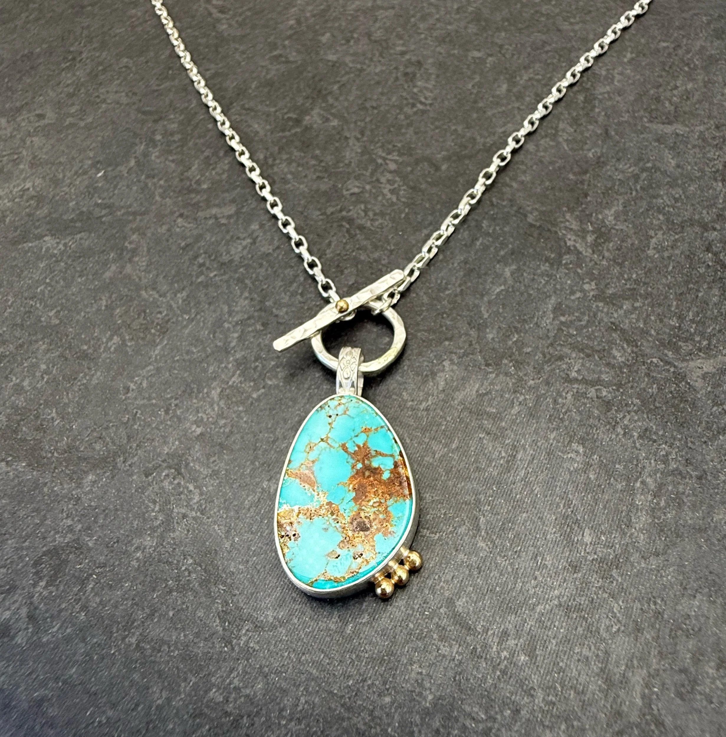 Silver Turquoise Pendant Necklace with Gold Accents