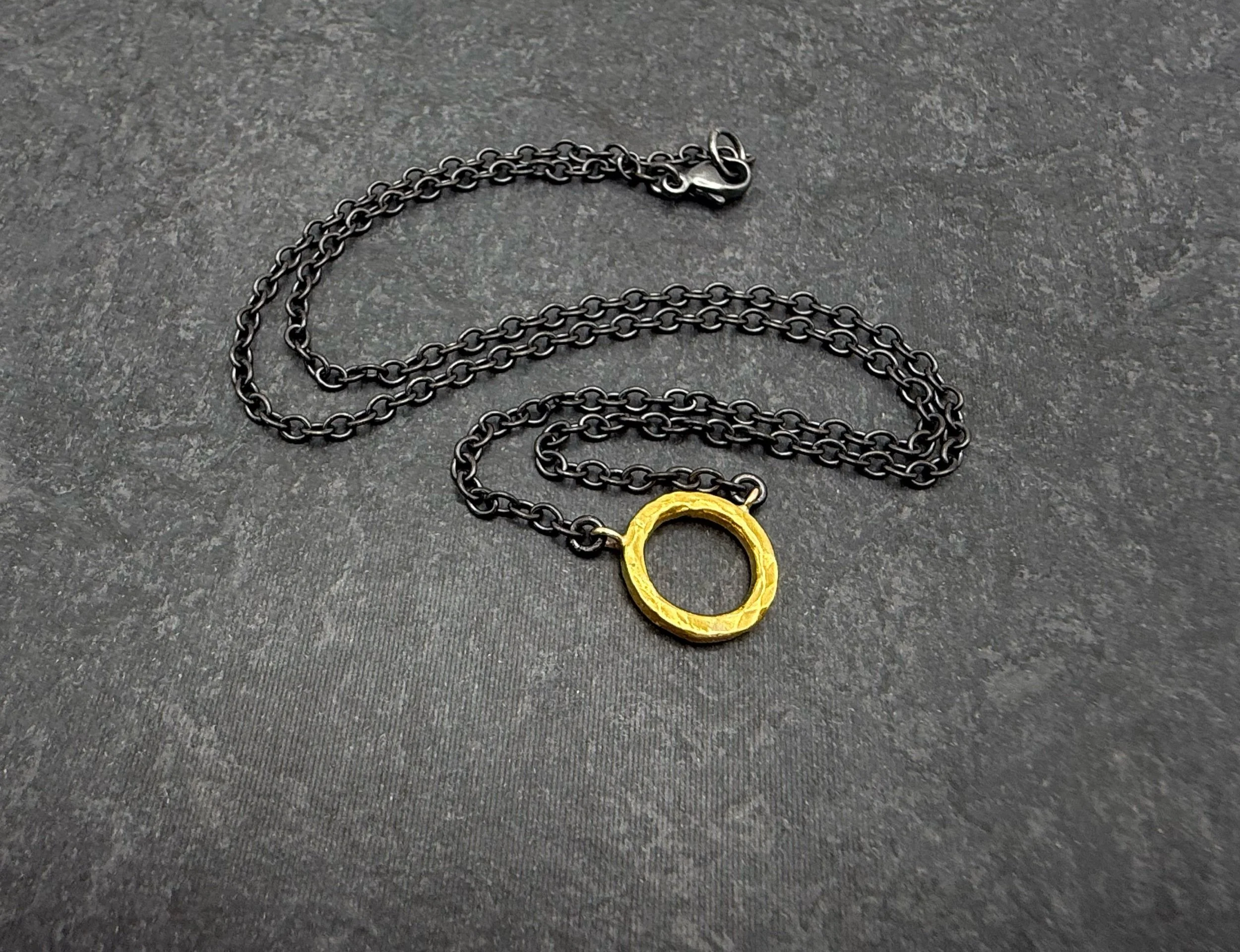 24k gold circle pendant with oxidized silver chain
