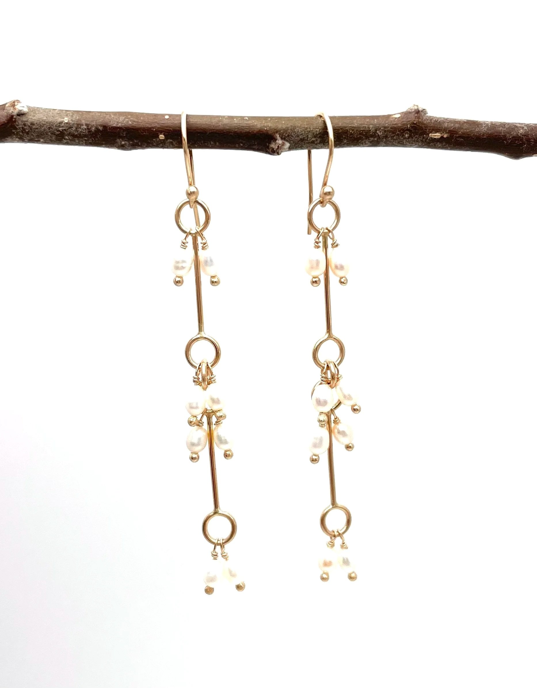 solid gold long dangle earring with white pearls