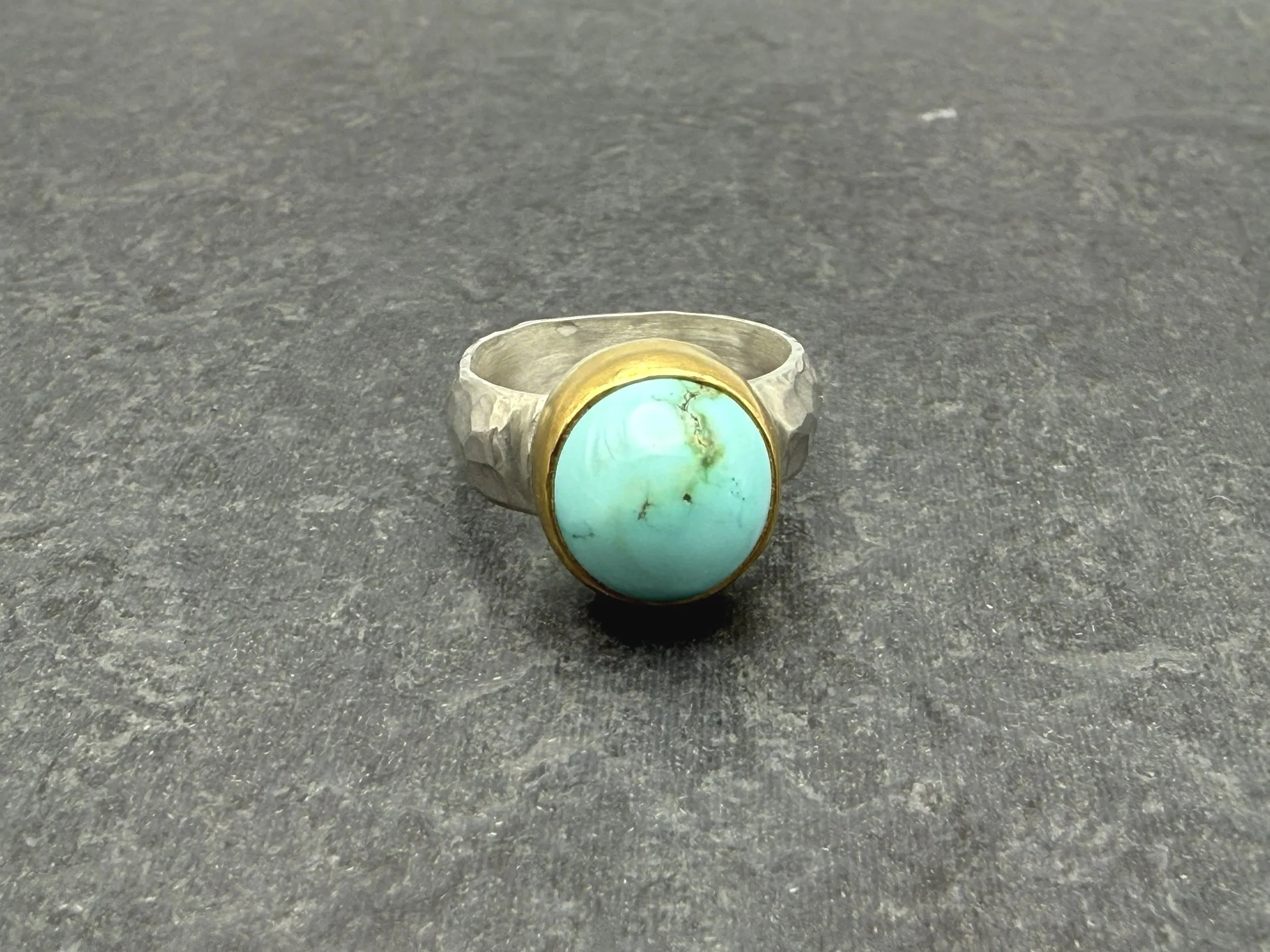 Blue turquoise ring with gold bezel and silver band