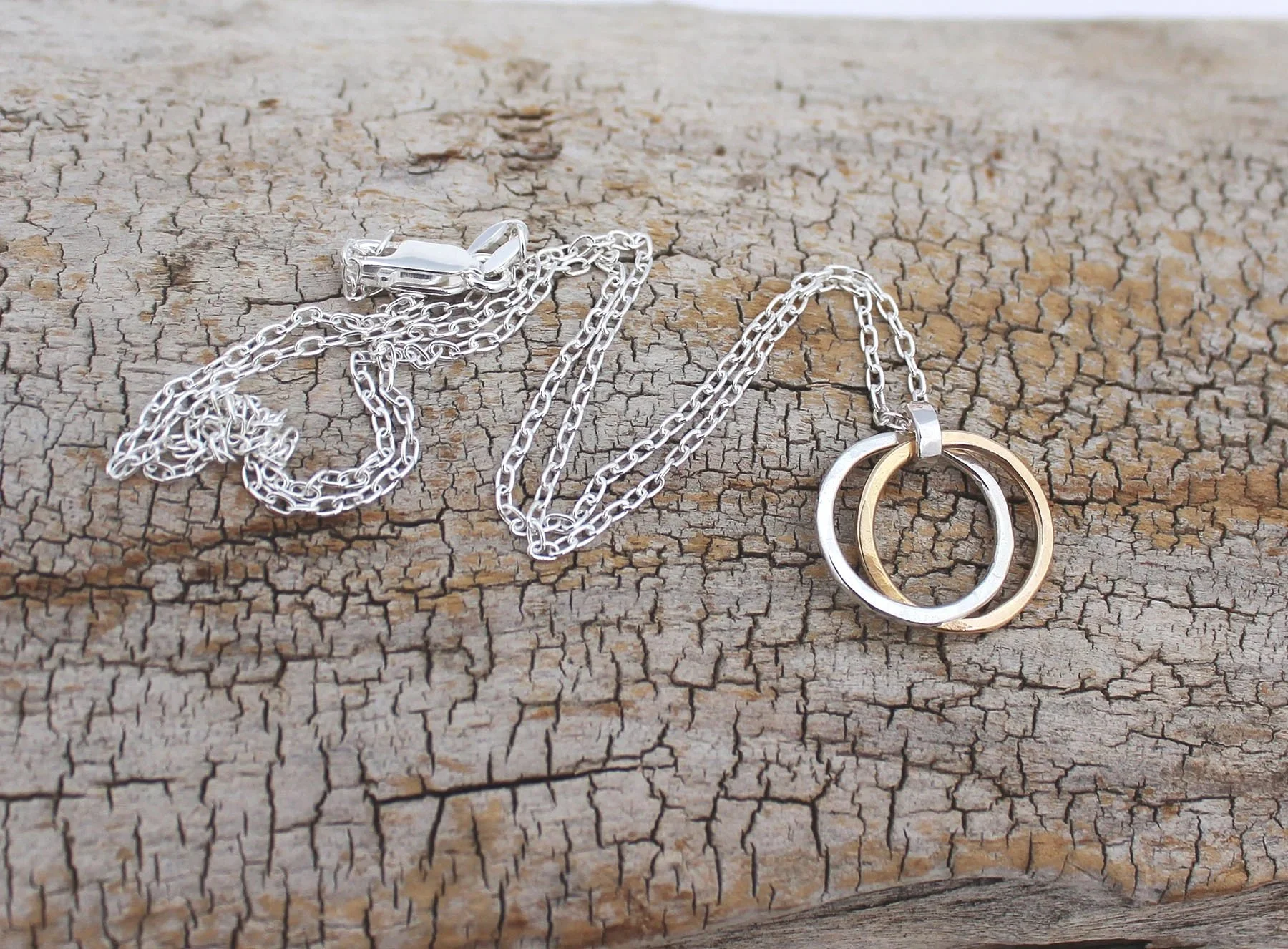 hammered two connected silver and gold circles necklace