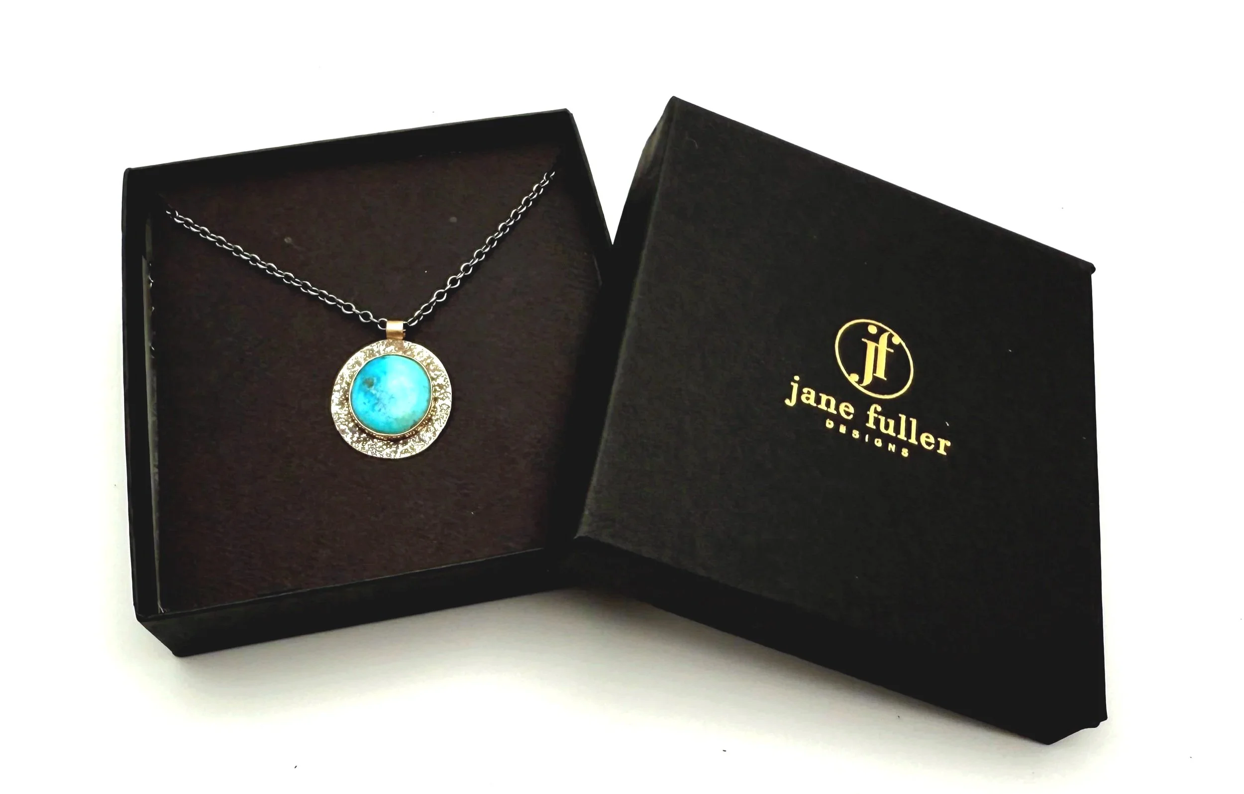 turquoise pendant with rustic hammered silver and 14k gold bezel