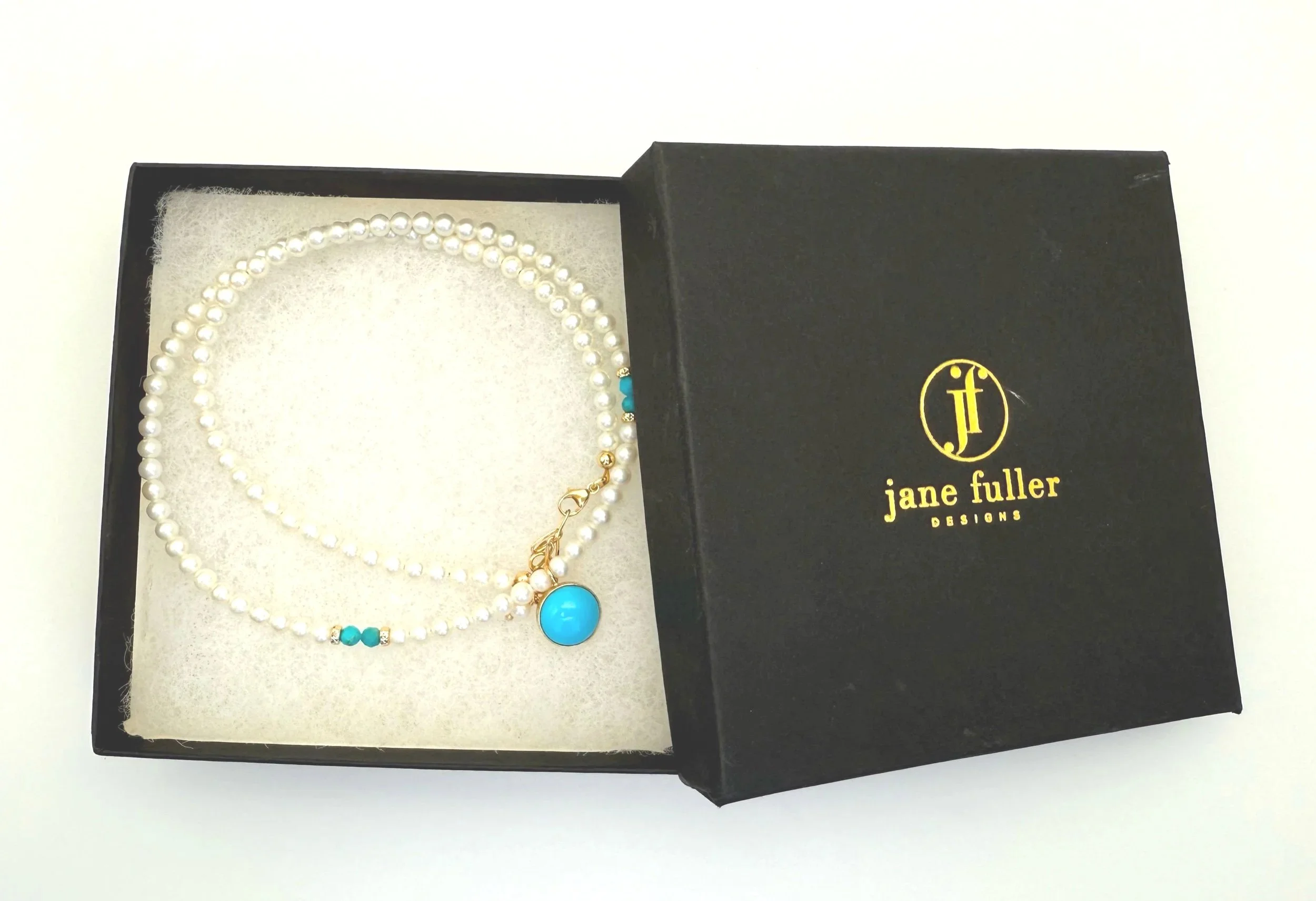 sleeping beauty turquoise on round pearl strand 14k gold