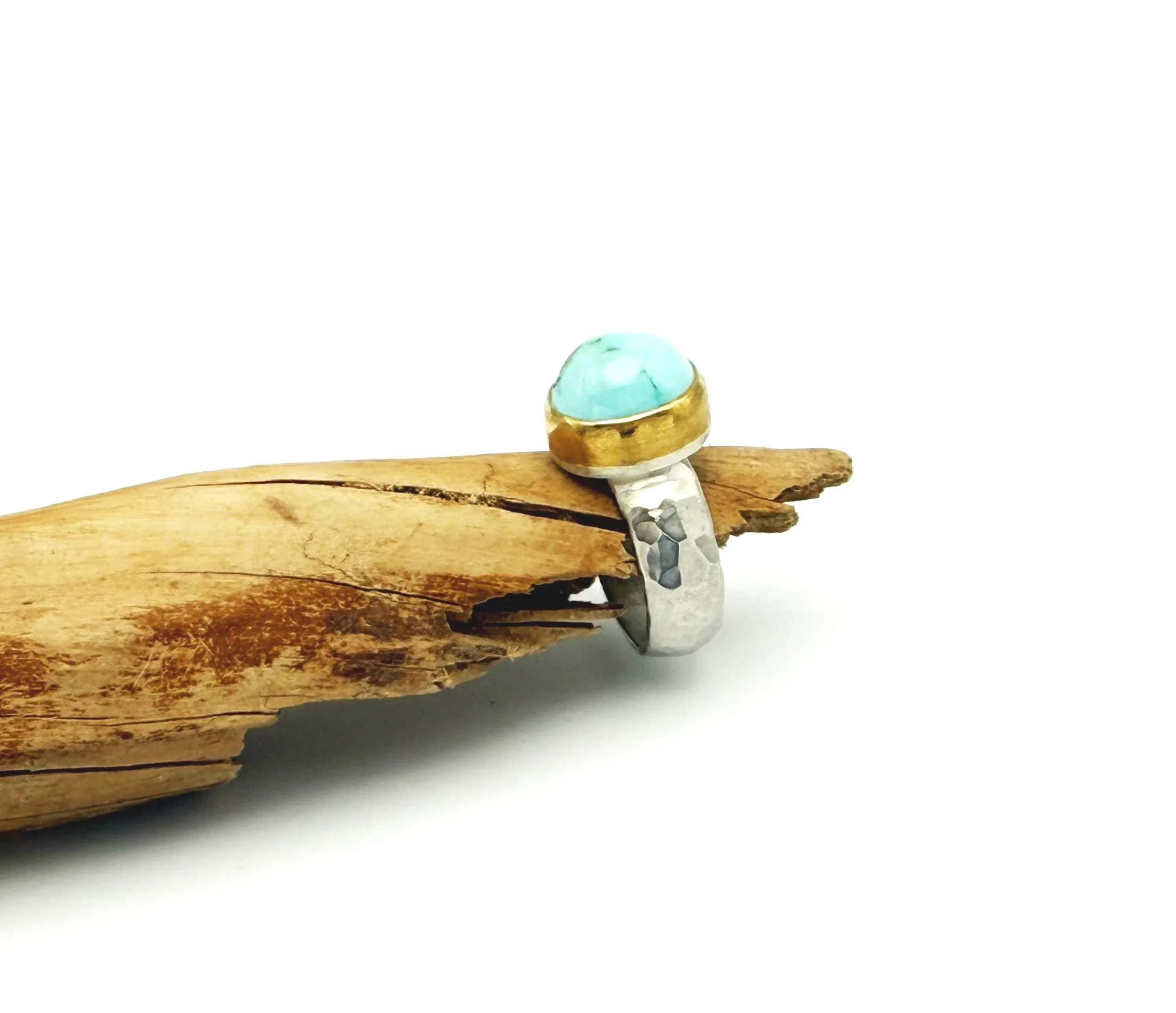American turquoise ring with 22k gold bezel and silver band