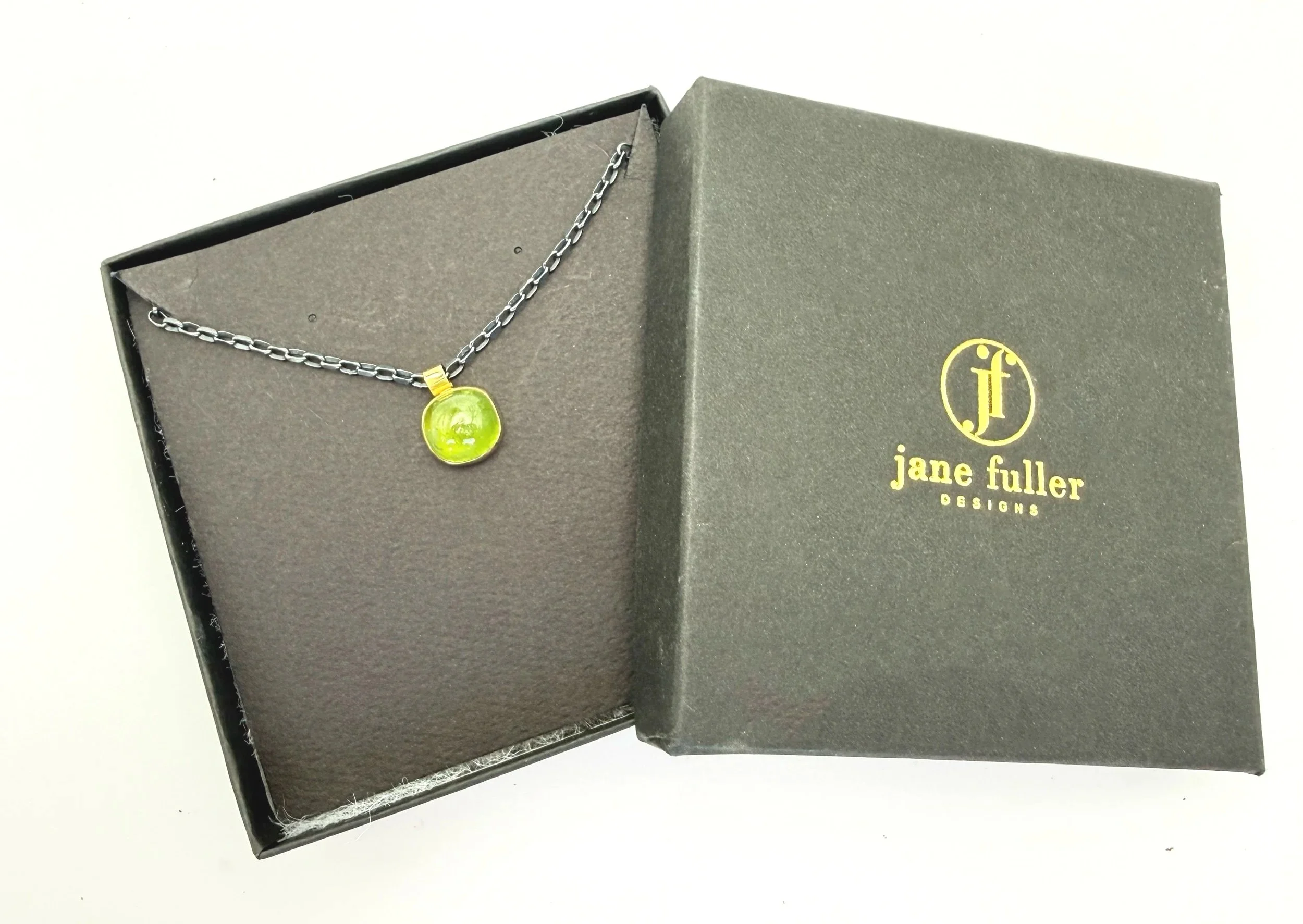 oxidized silver chain with solid gold green peridot pendant