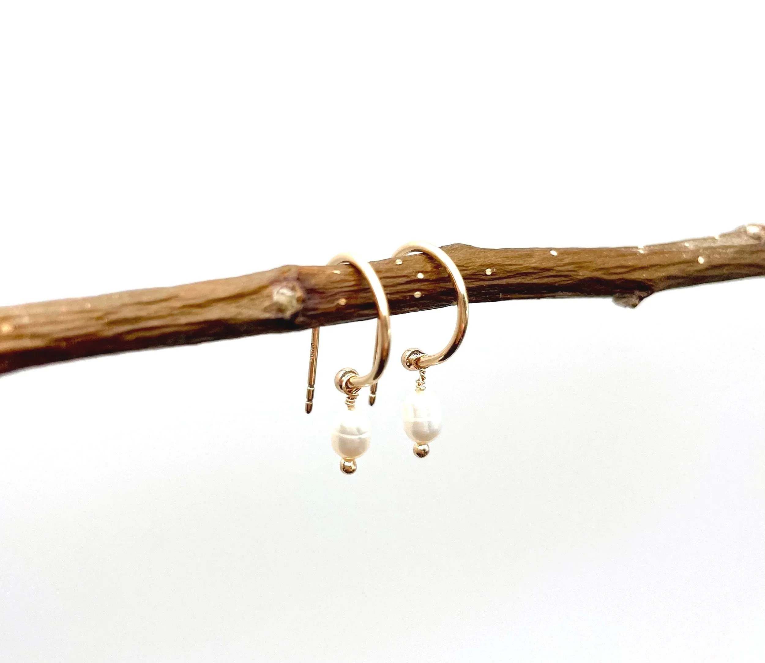 dainty solid gold hoops with pearl drops