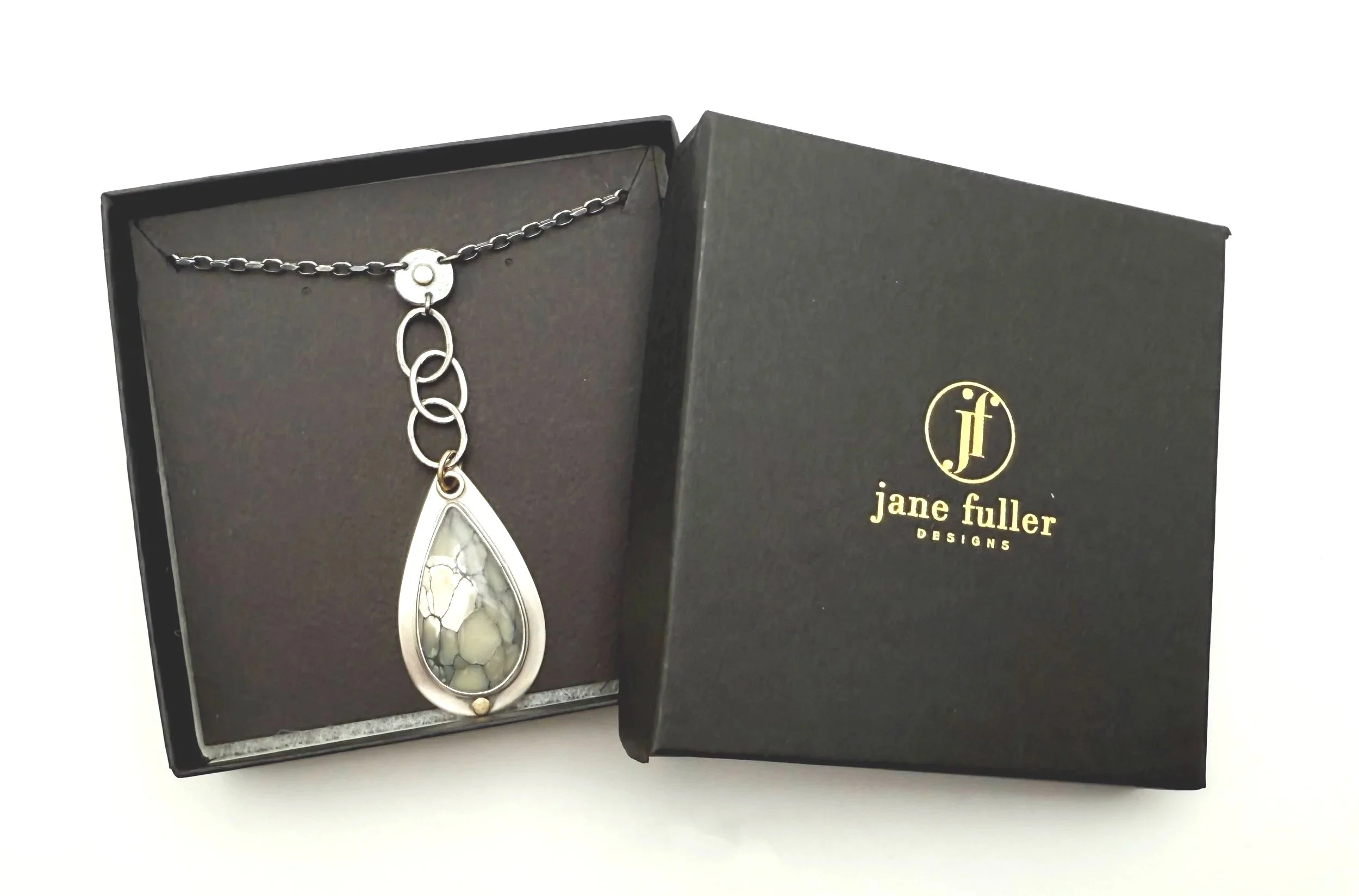 mottled white and gray stone pendant necklace in sterling silver with 14k gold accents