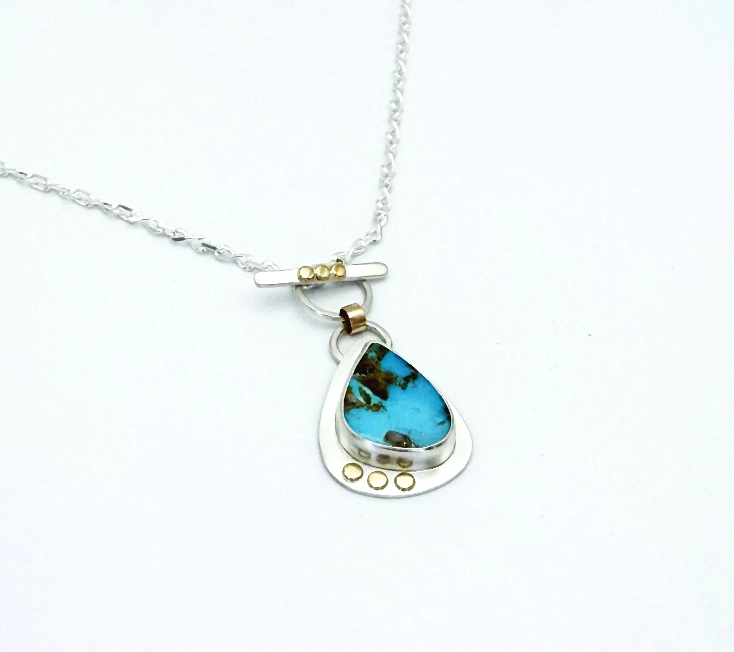 Blue Gem turquoise necklace on a sterling silver figure-eight chain, on white