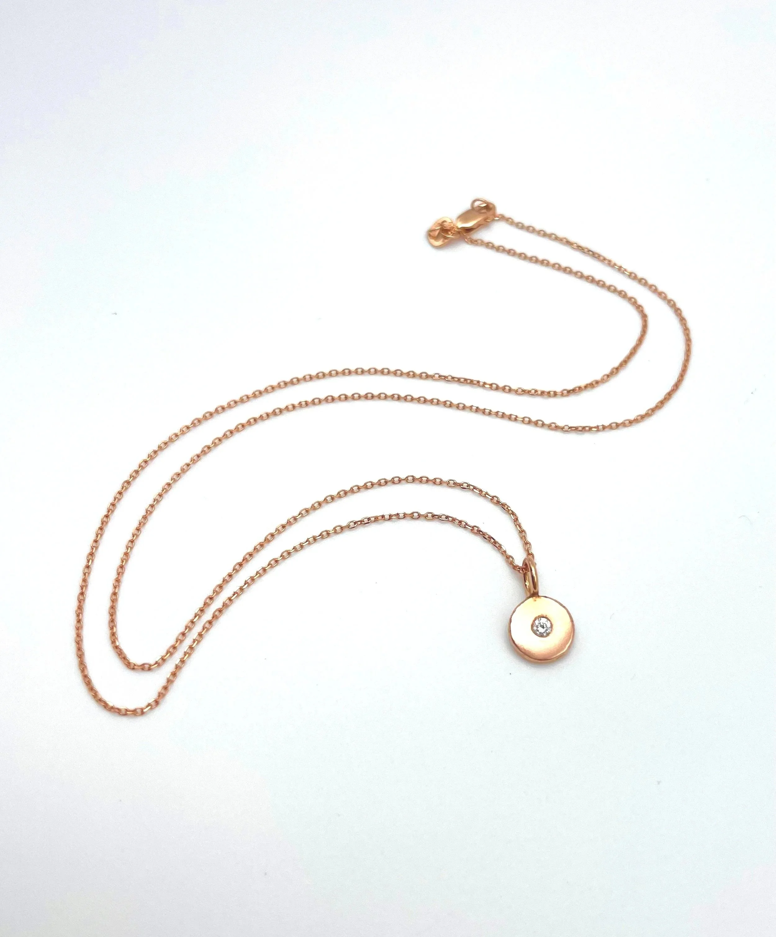 Rose gold dainty disc necklace with small diamond