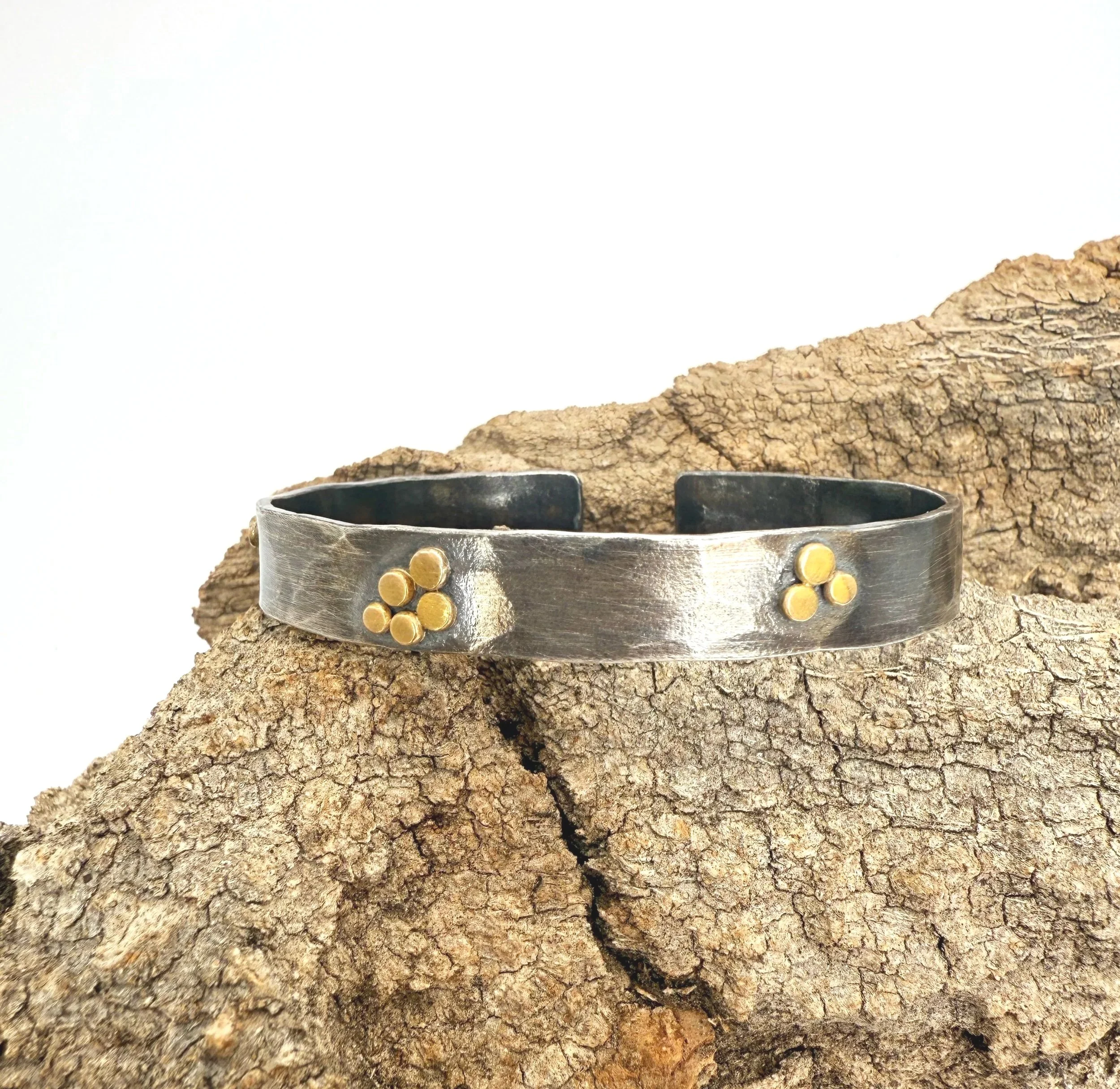wide blackened silver cuff with solid gold dots