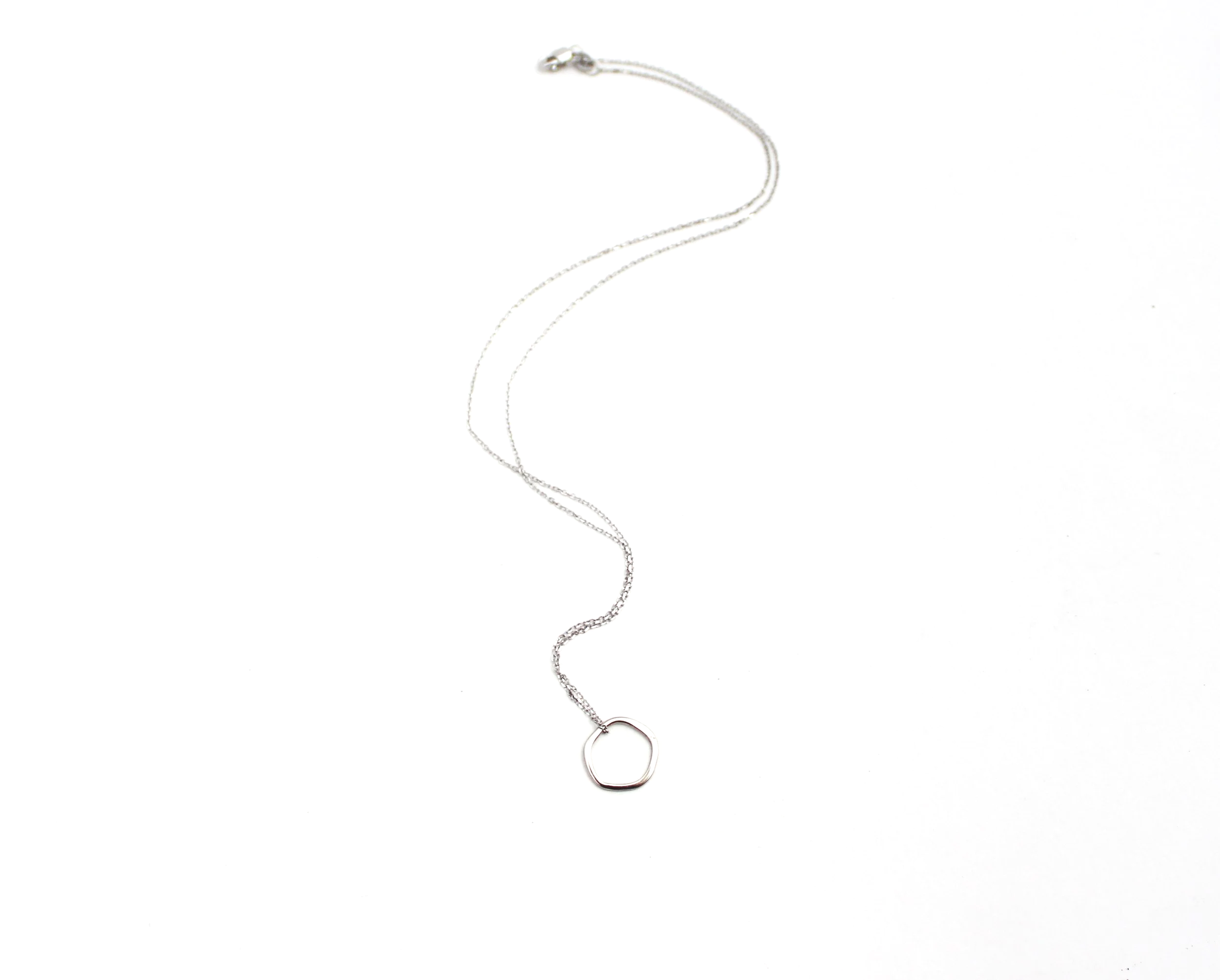 irregular shaped open circle pendant with cable chain in white gold