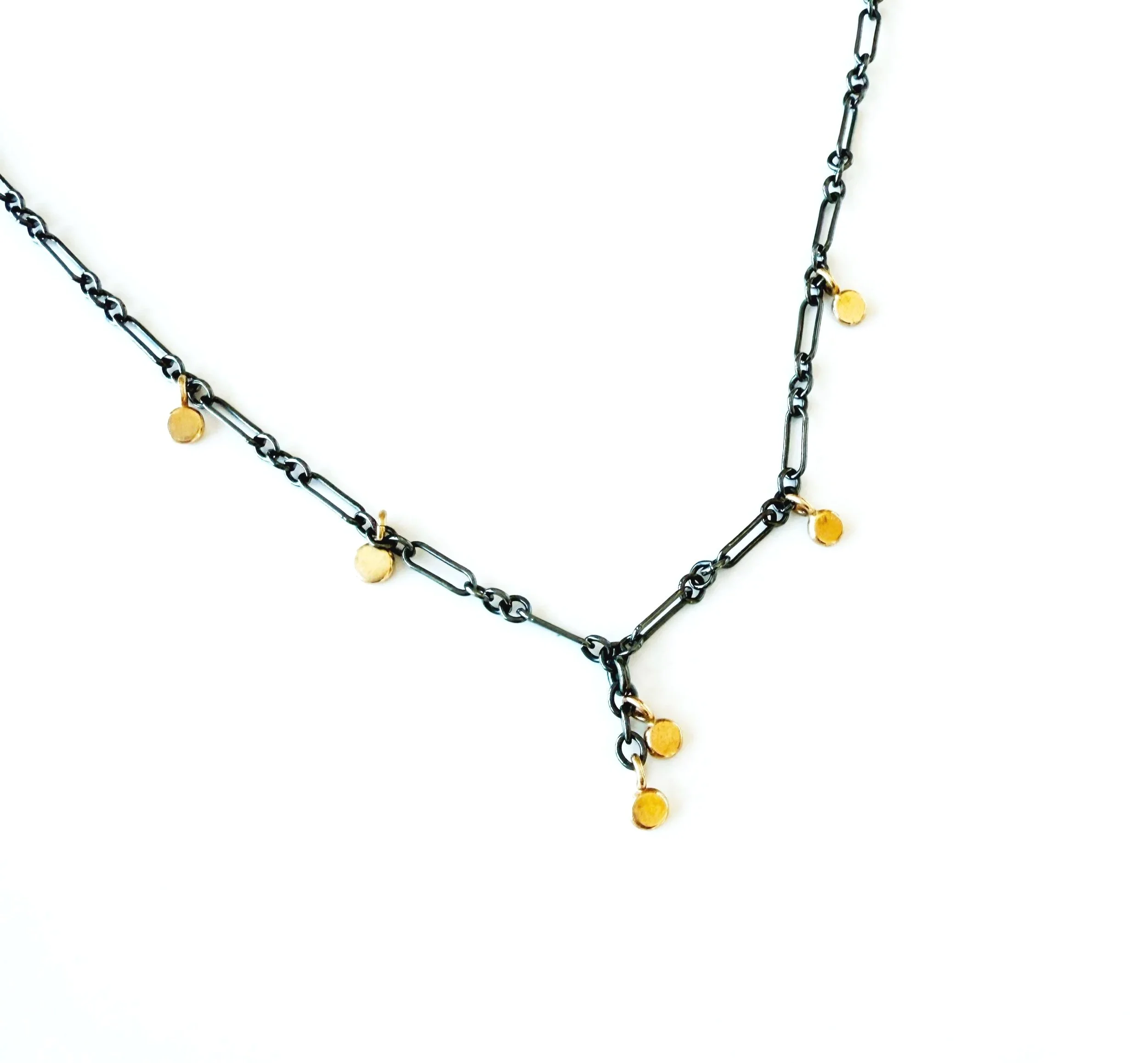 oxidized silver chain with small 14k gold discs dangling