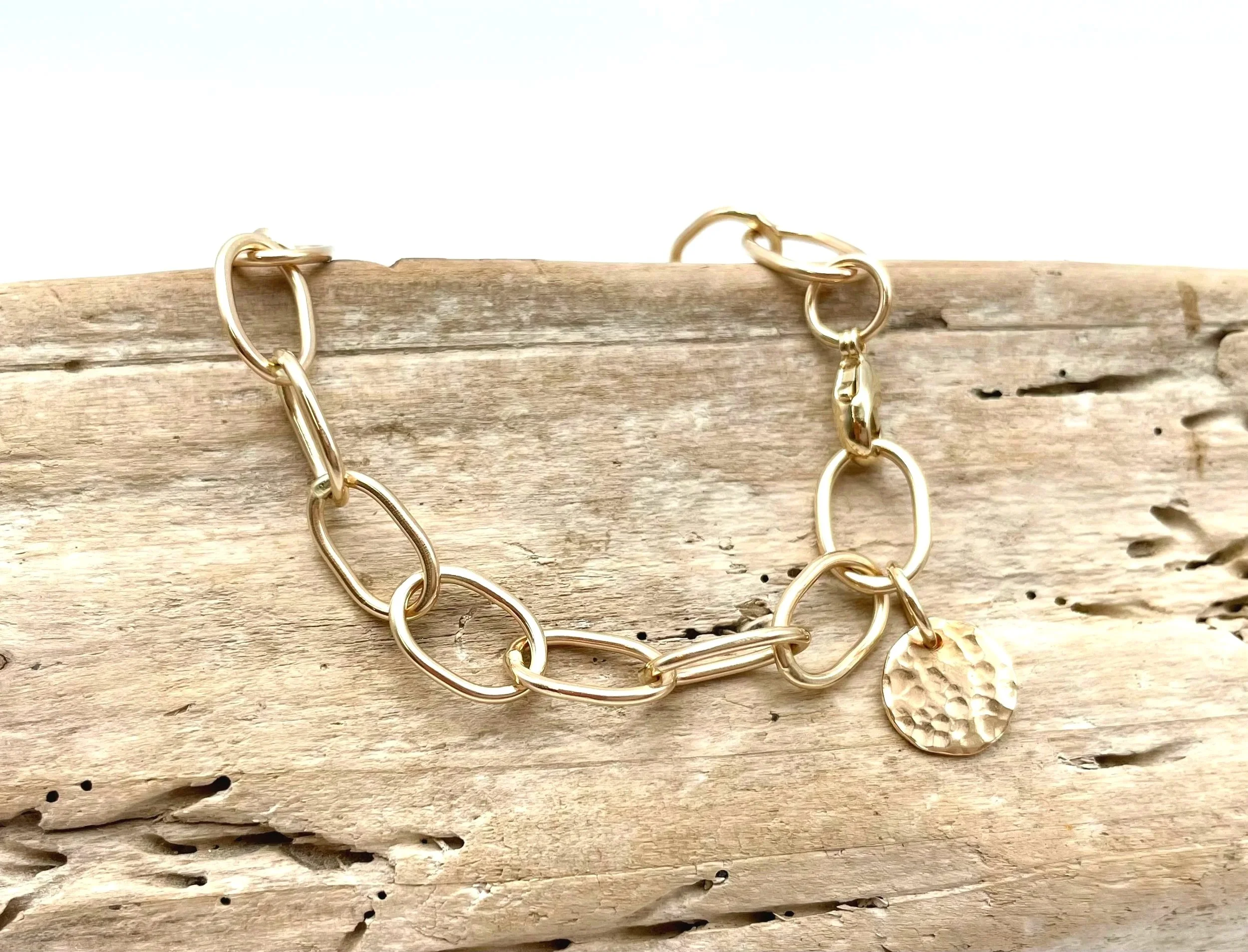 artisan made gold link bracelet with hammered disc