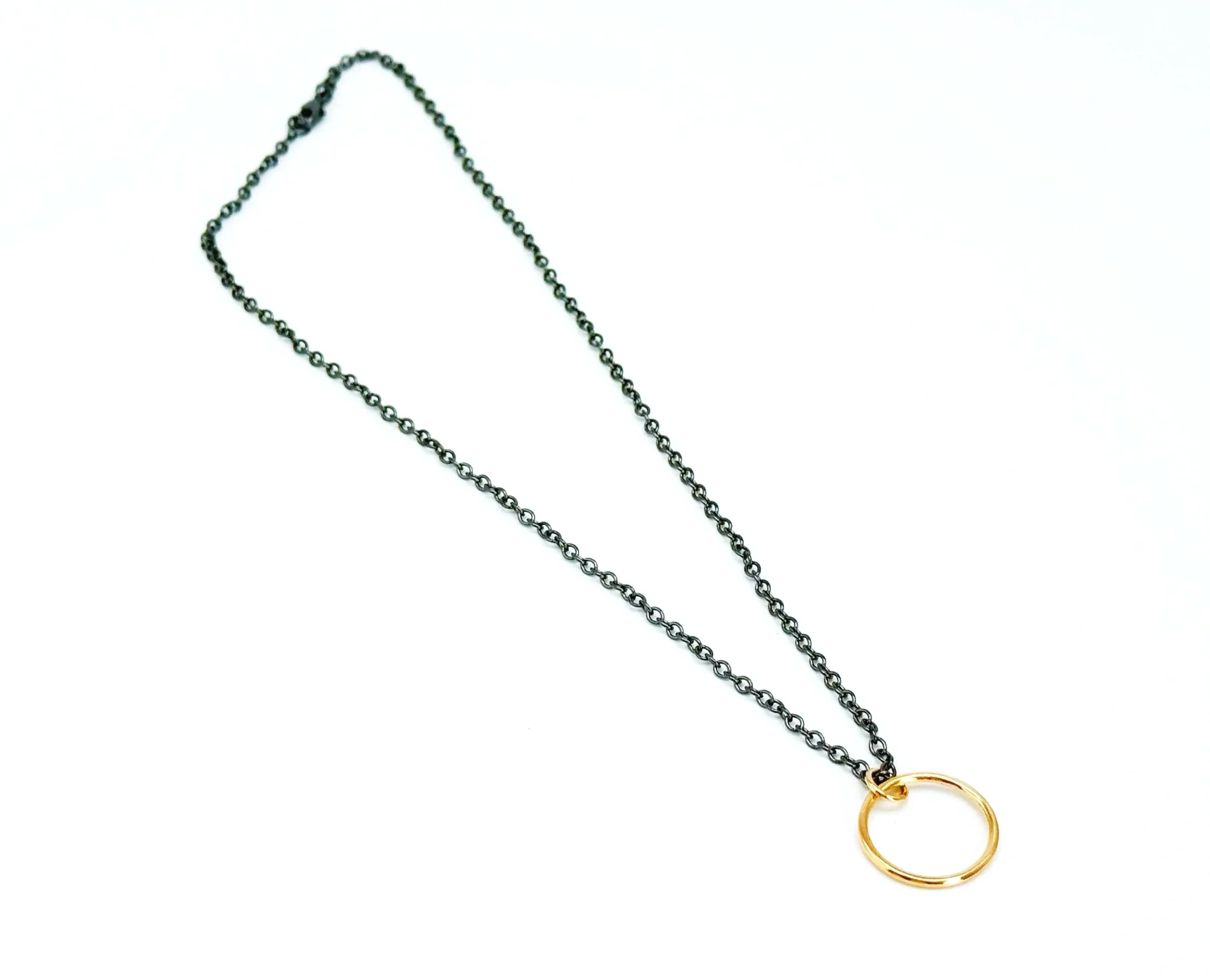 blackened silver chain necklace with gold circle pendant