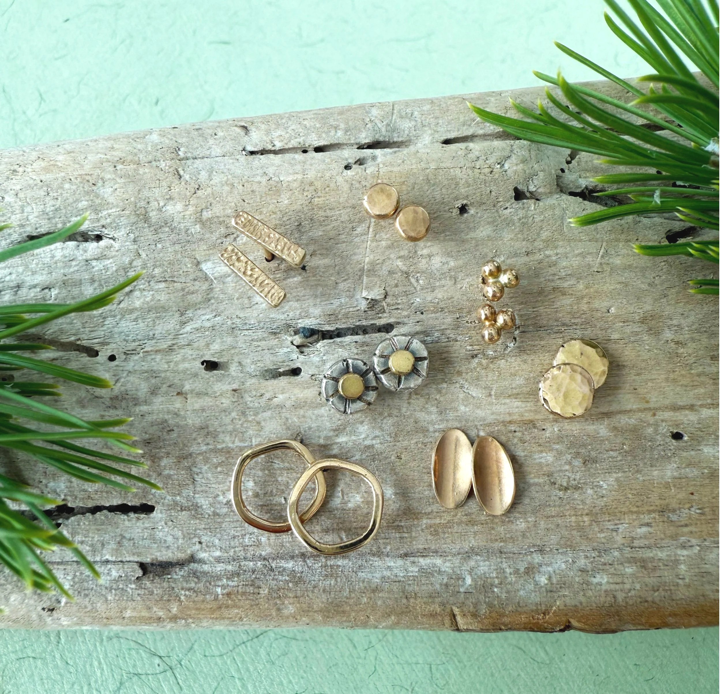 handcrafted unique solid gold stud earrings