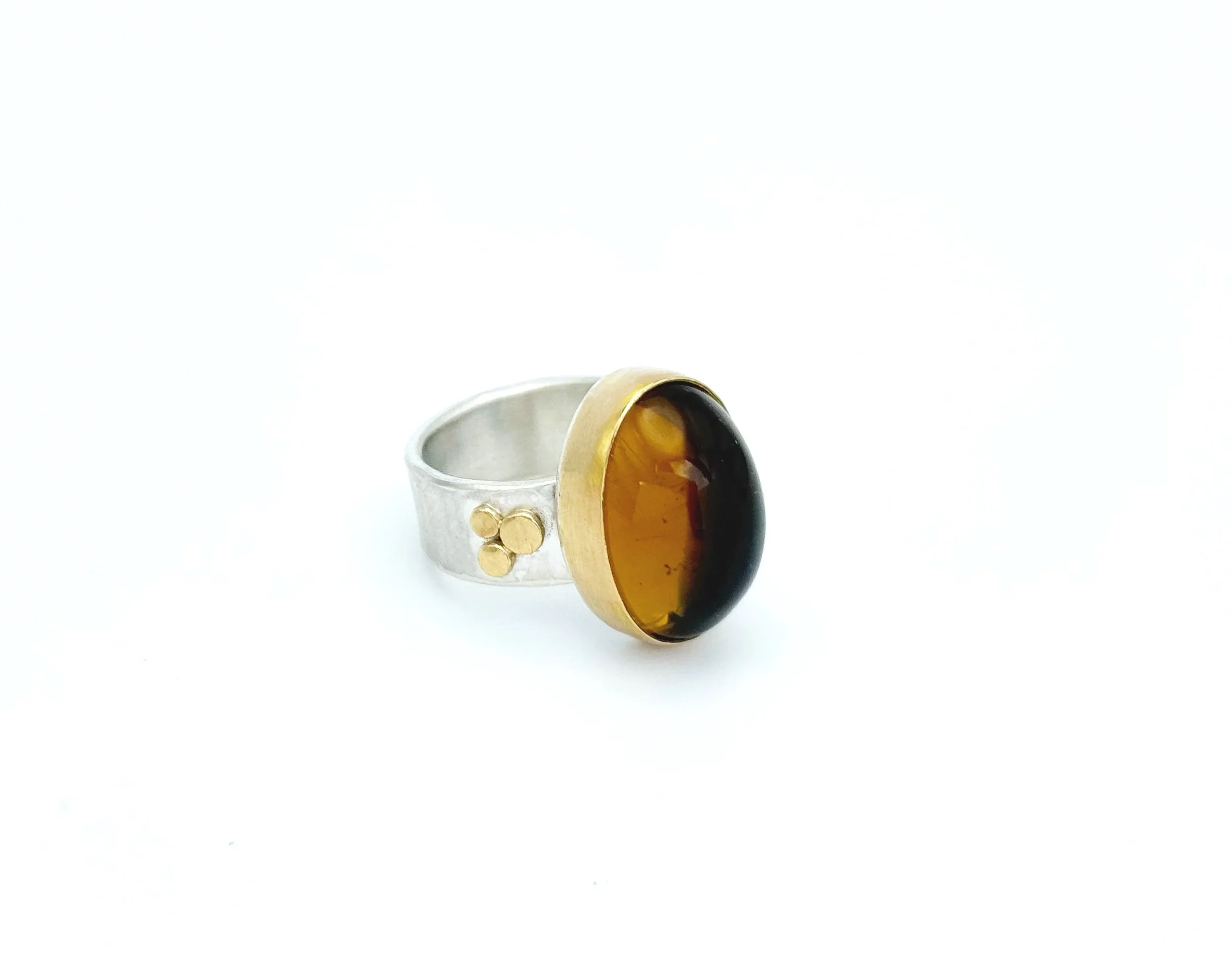 Citrine ring on white, showing the brushed silver band and gold dots