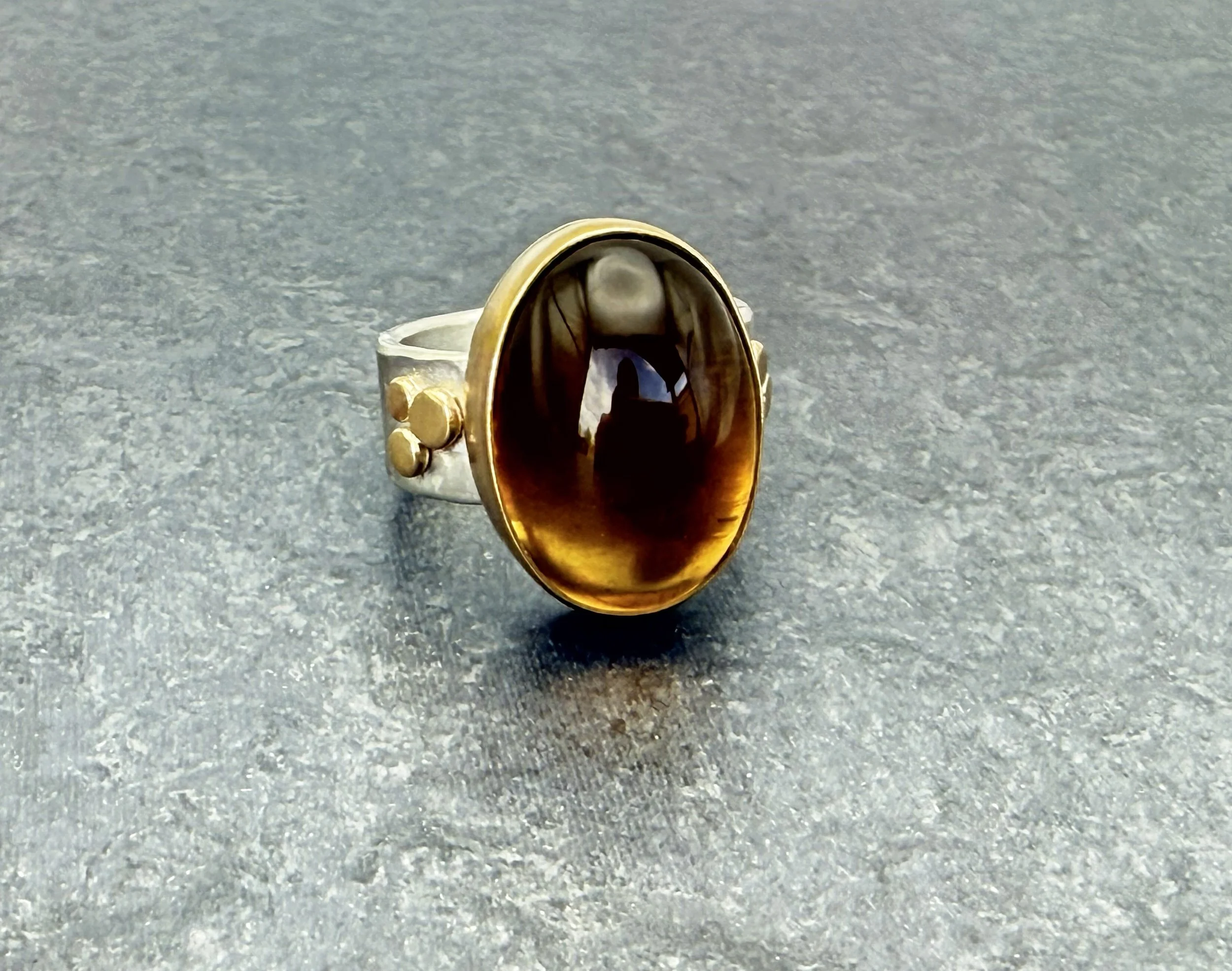 Citrine and 14k gold bezel ring on dark slate