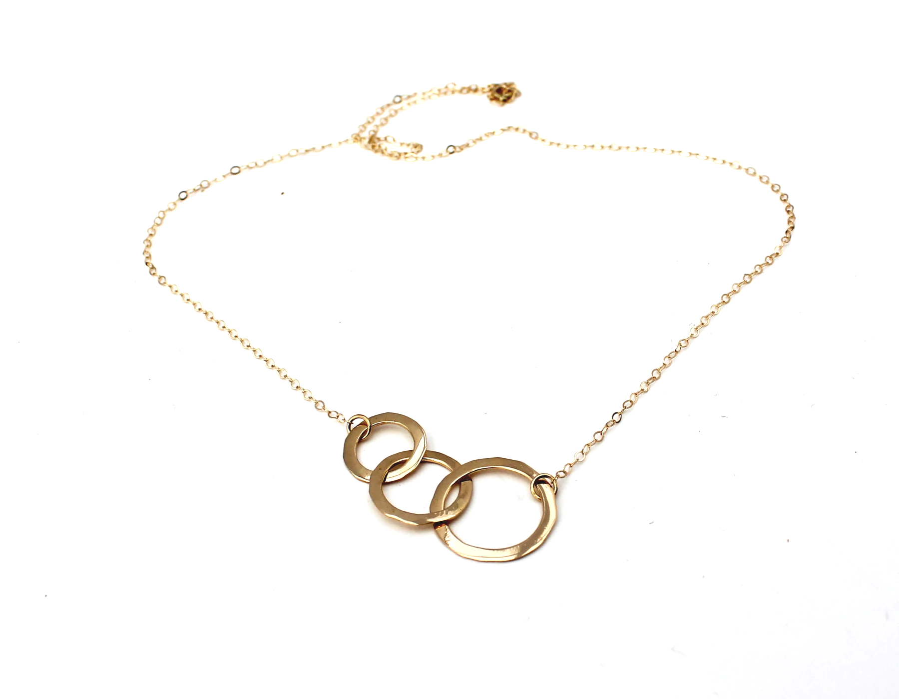 three connected circles in 14k gold representing family or generations