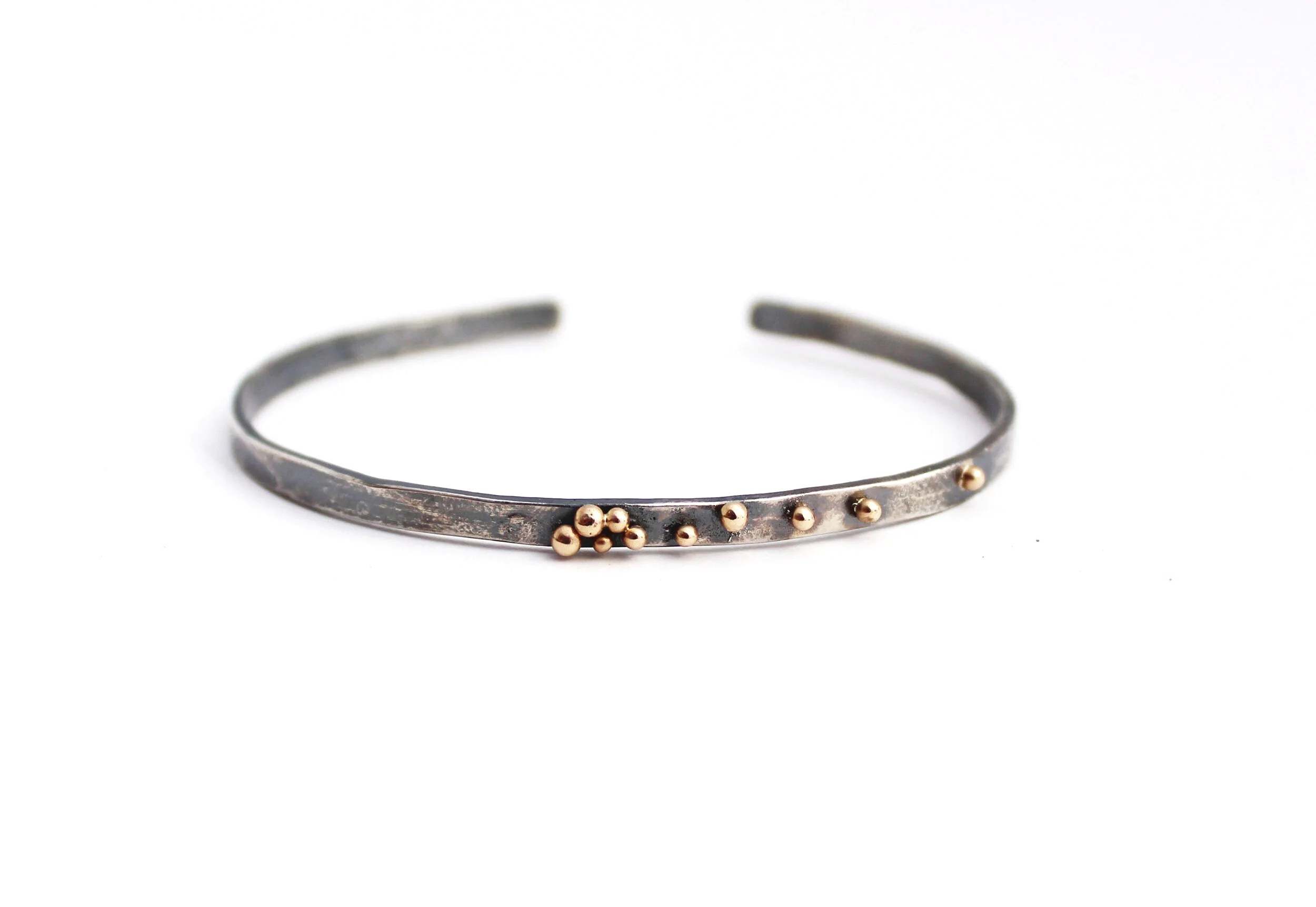 oxidized silver cuff bracelet with 14k gold