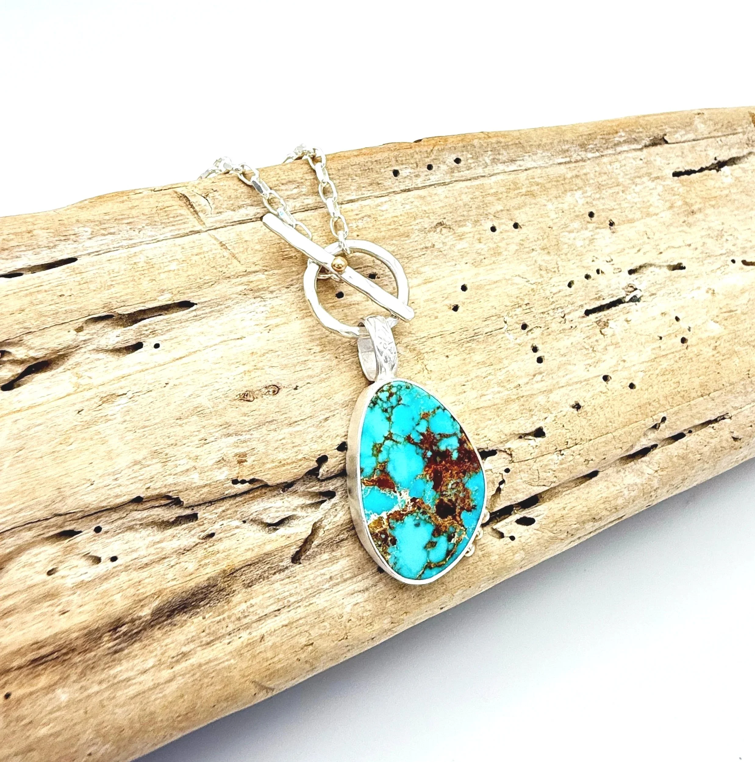large silver turquoise pendant necklace with 14k solid gold detail