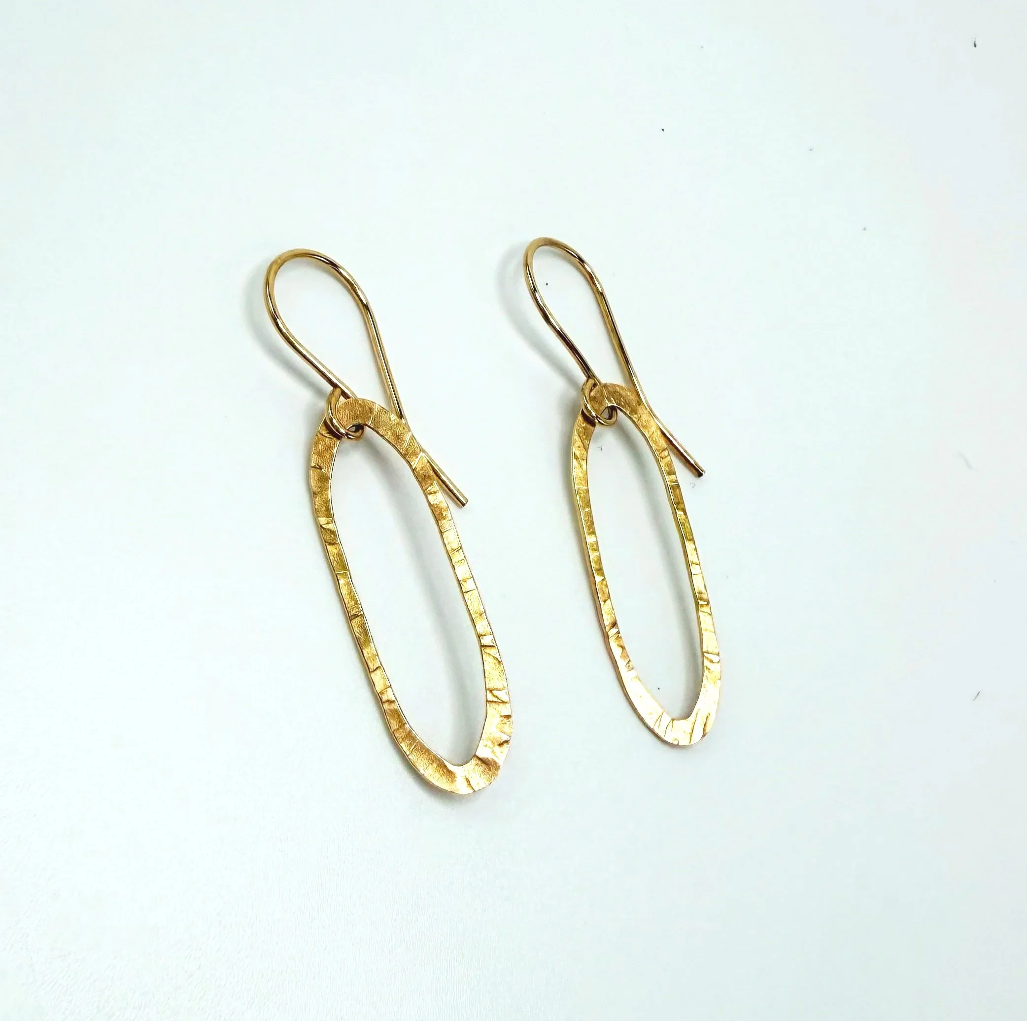 14k gold oval hoop earrings with hammer texture